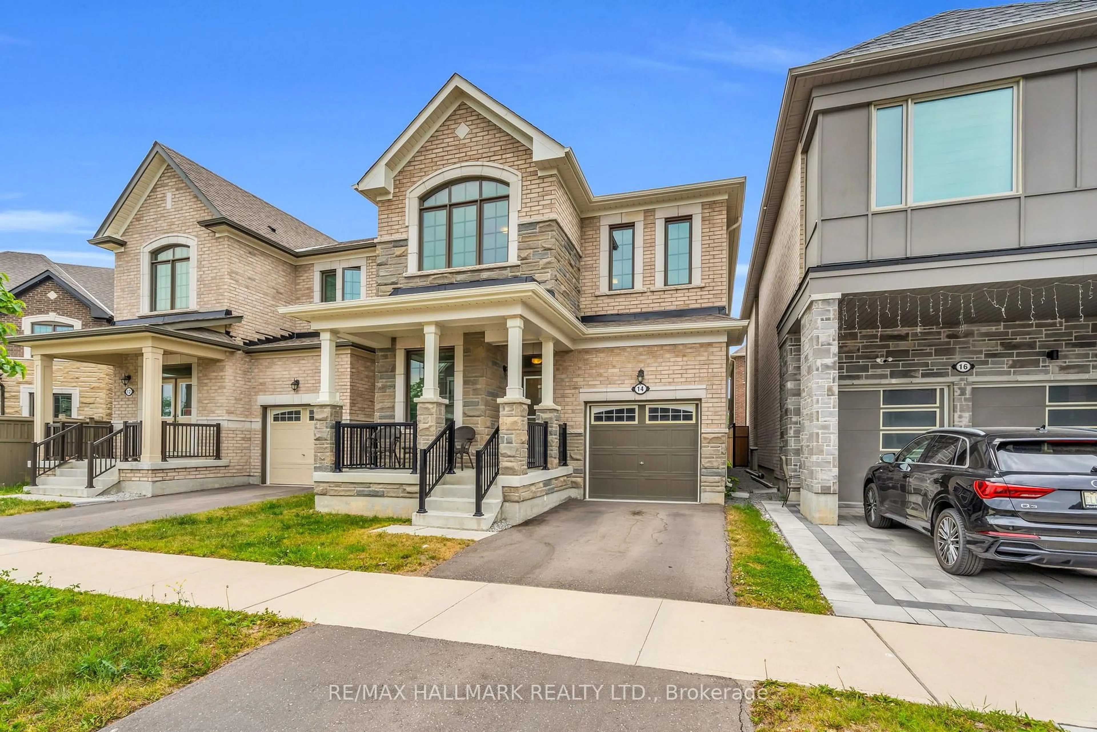 Home with brick exterior material, street for 14 Eberly Woods Dr, Markham Ontario L6C 3K5