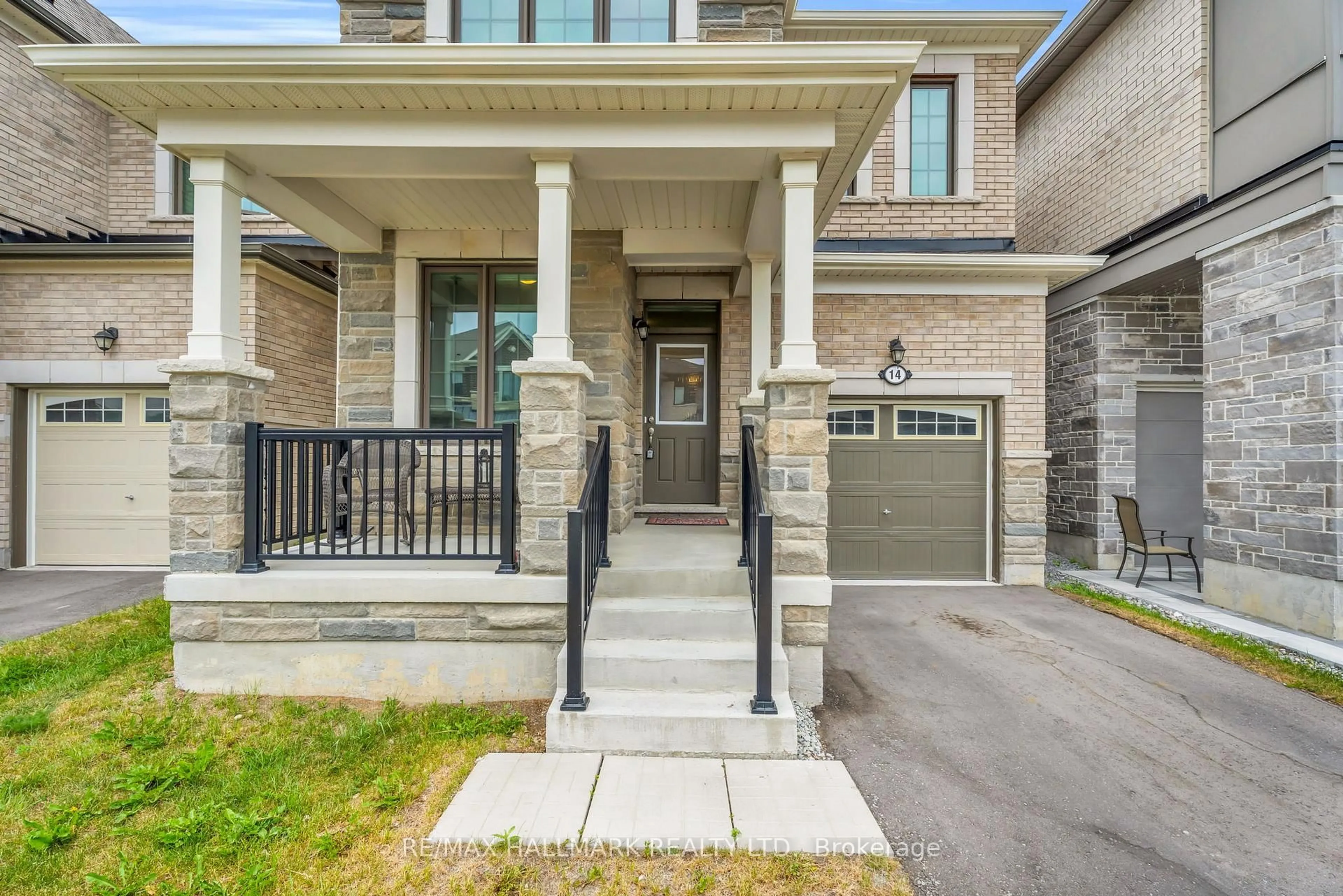 Home with brick exterior material, street for 14 Eberly Woods Dr, Markham Ontario L6C 3K5