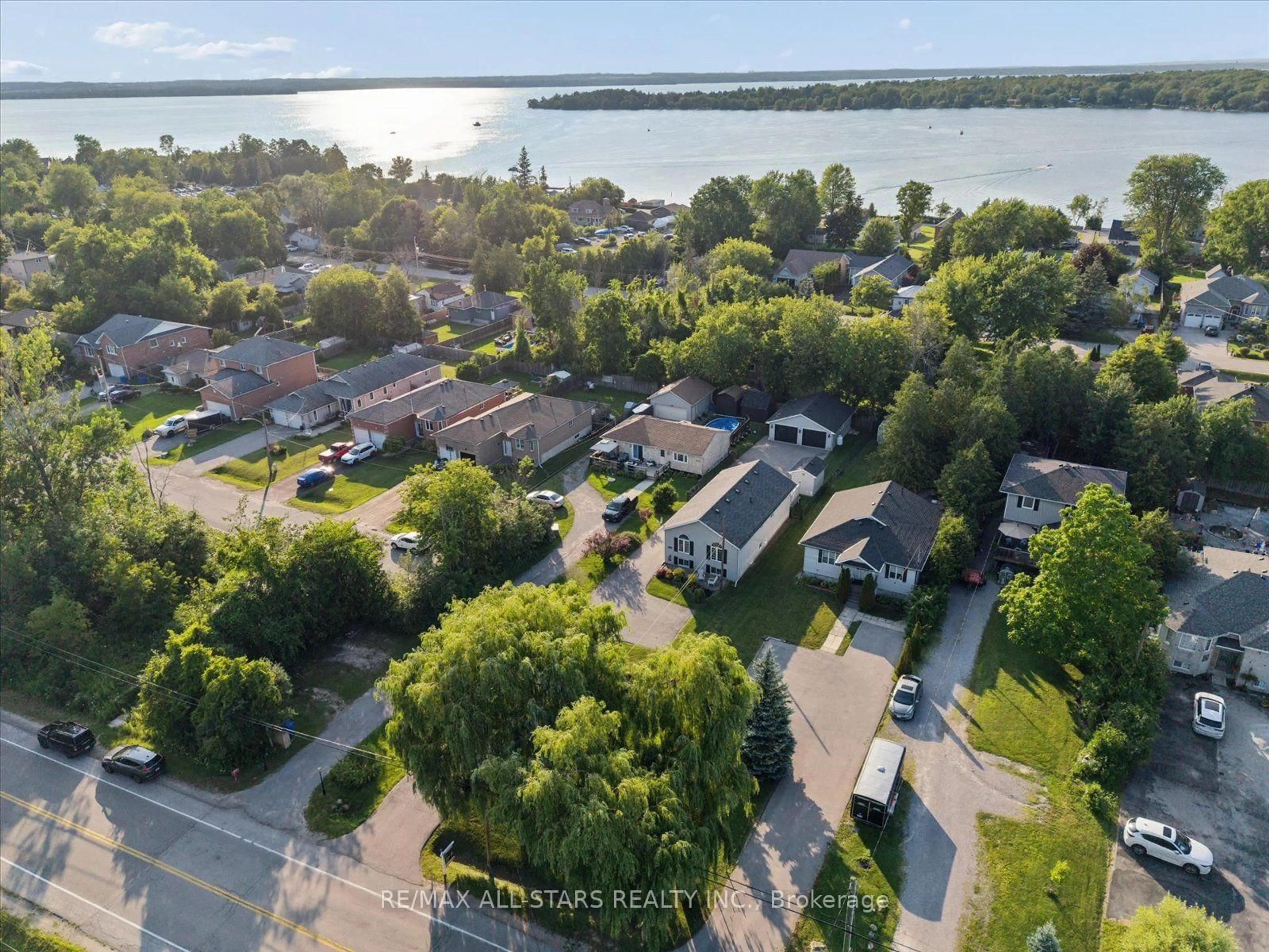 A pic from outside/outdoor area/front of a property/back of a property/a pic from drone, water/lake/river/ocean view for 1008 Metro Rd, Georgina Ontario L4P 3E9