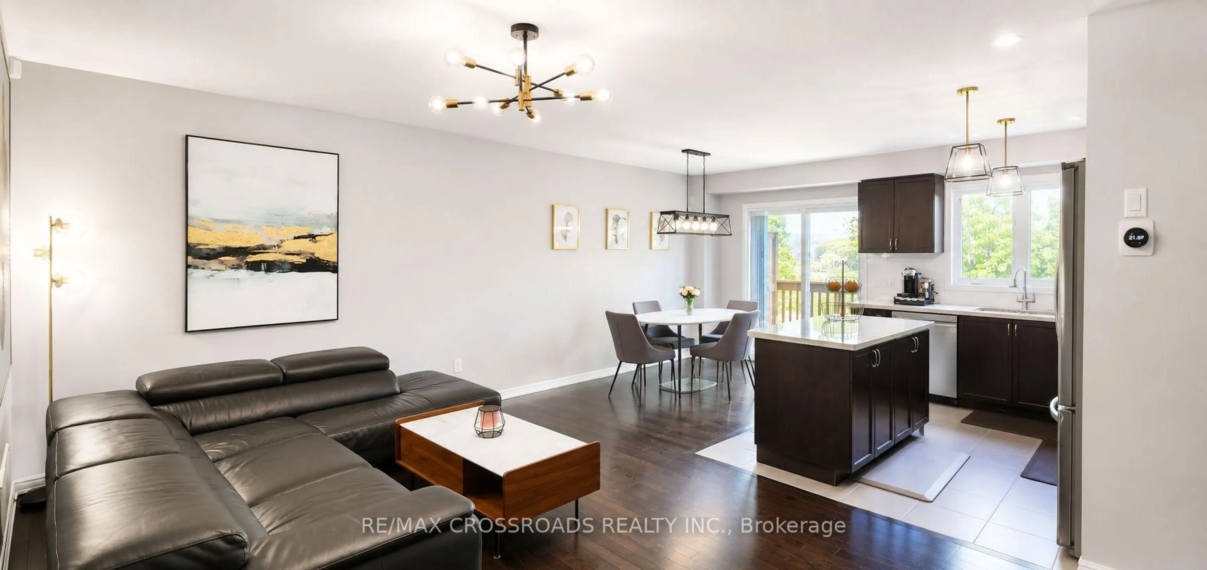 Living room with furniture, wood/laminate floor for 53 Edwin Pearson St, Aurora Ontario L4G 0S2