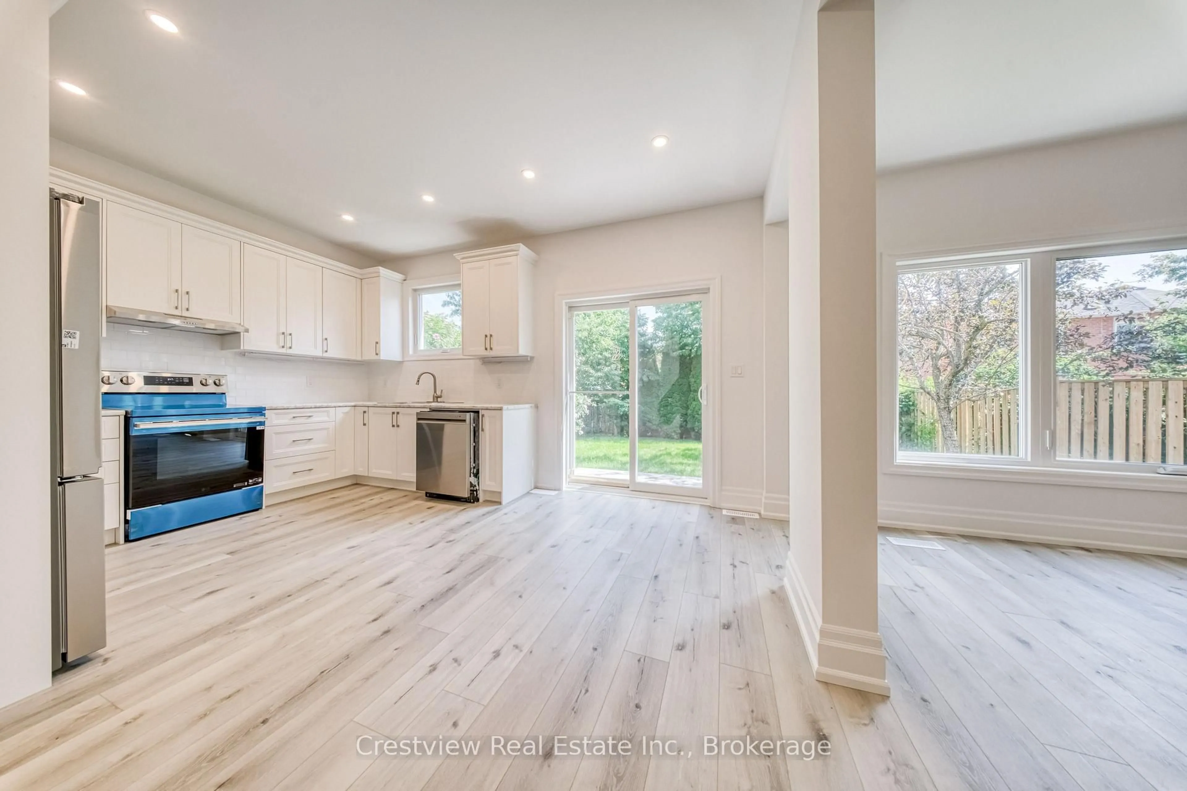 Open concept kitchen, wood/laminate floor for 49 Sandham Cres, Markham Ontario L3S 3M2
