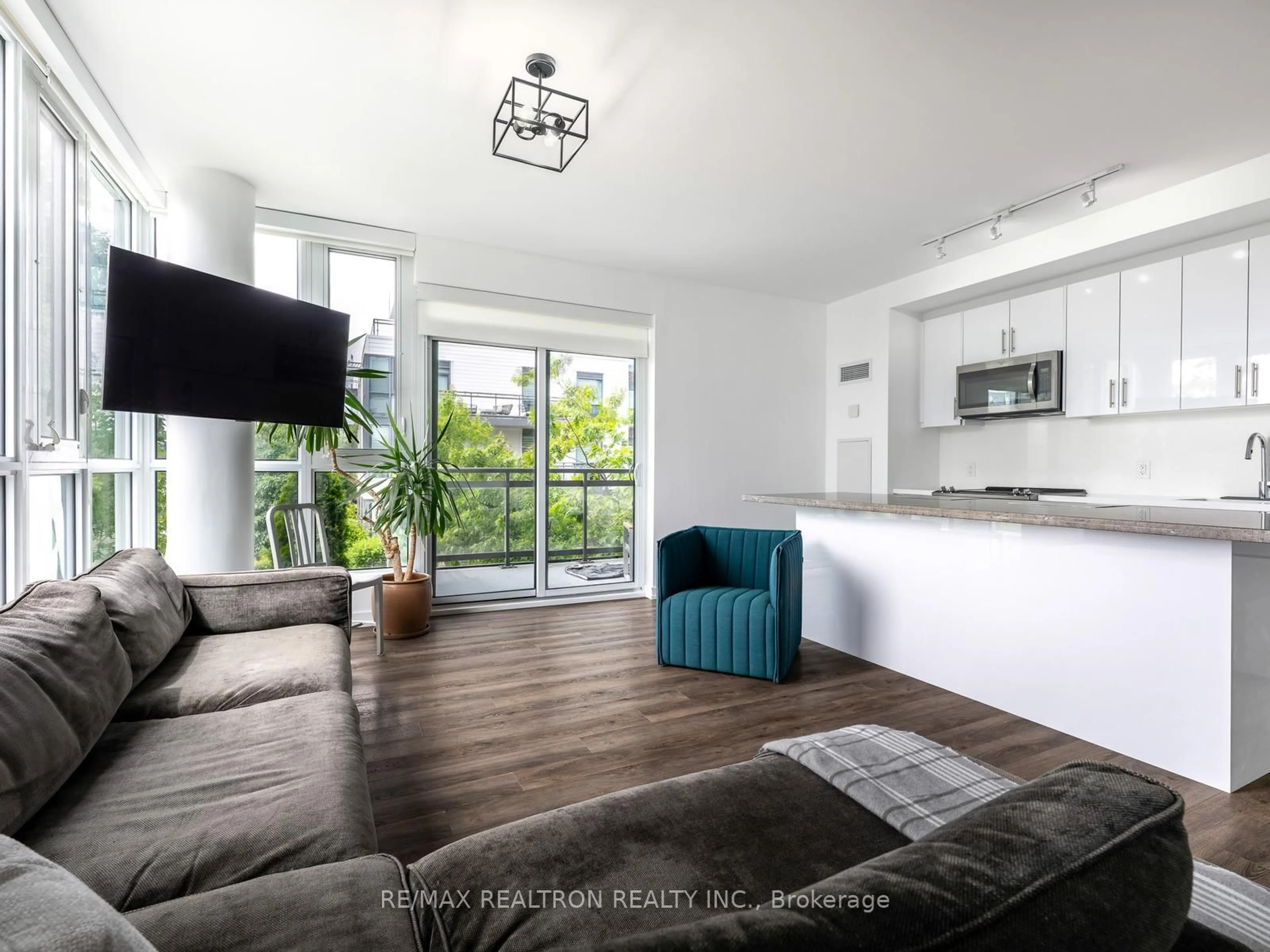 Living room with furniture, wood/laminate floor for 271 Sea Ray Ave #B208, Innisfil Ontario L9S 0J4