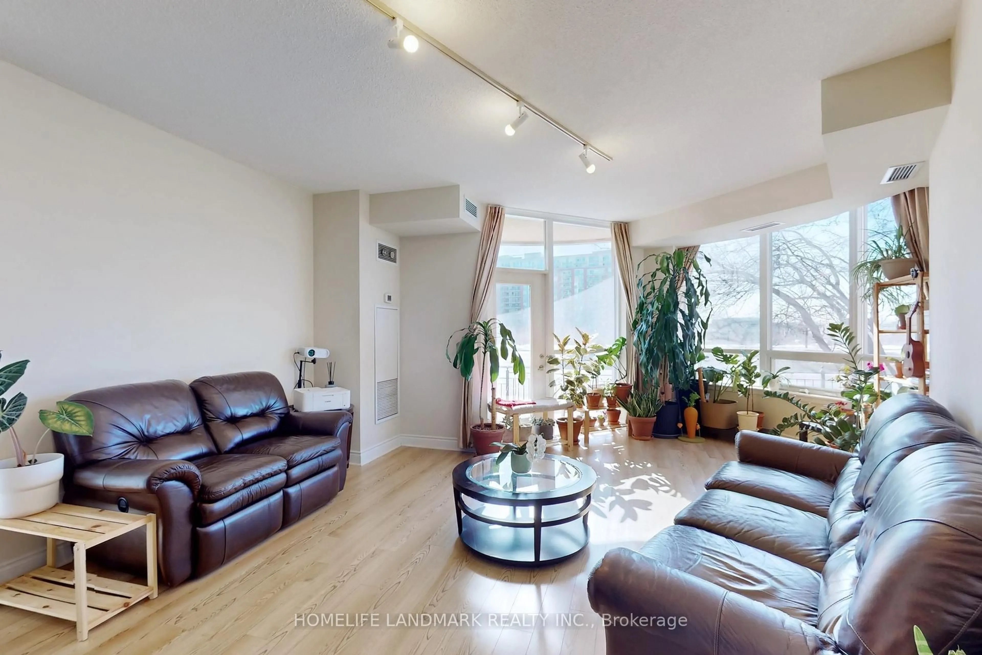 Living room with furniture, wood/laminate floor for 23 Cox Blvd #163, Markham Ontario L3R 7Z9
