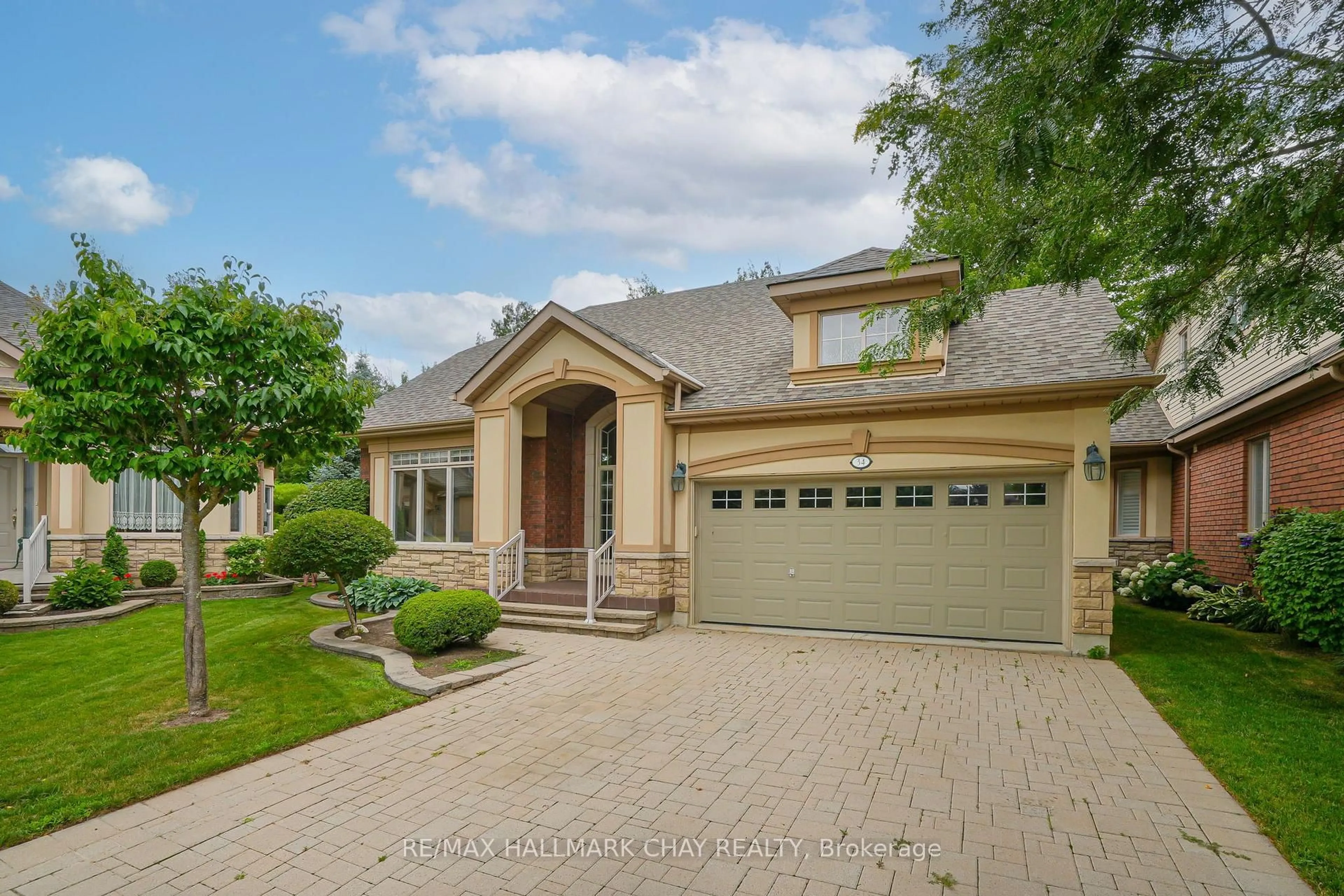 Home with brick exterior material, street for 34 Tuscany Grande, New Tecumseth Ontario L9R 0E2