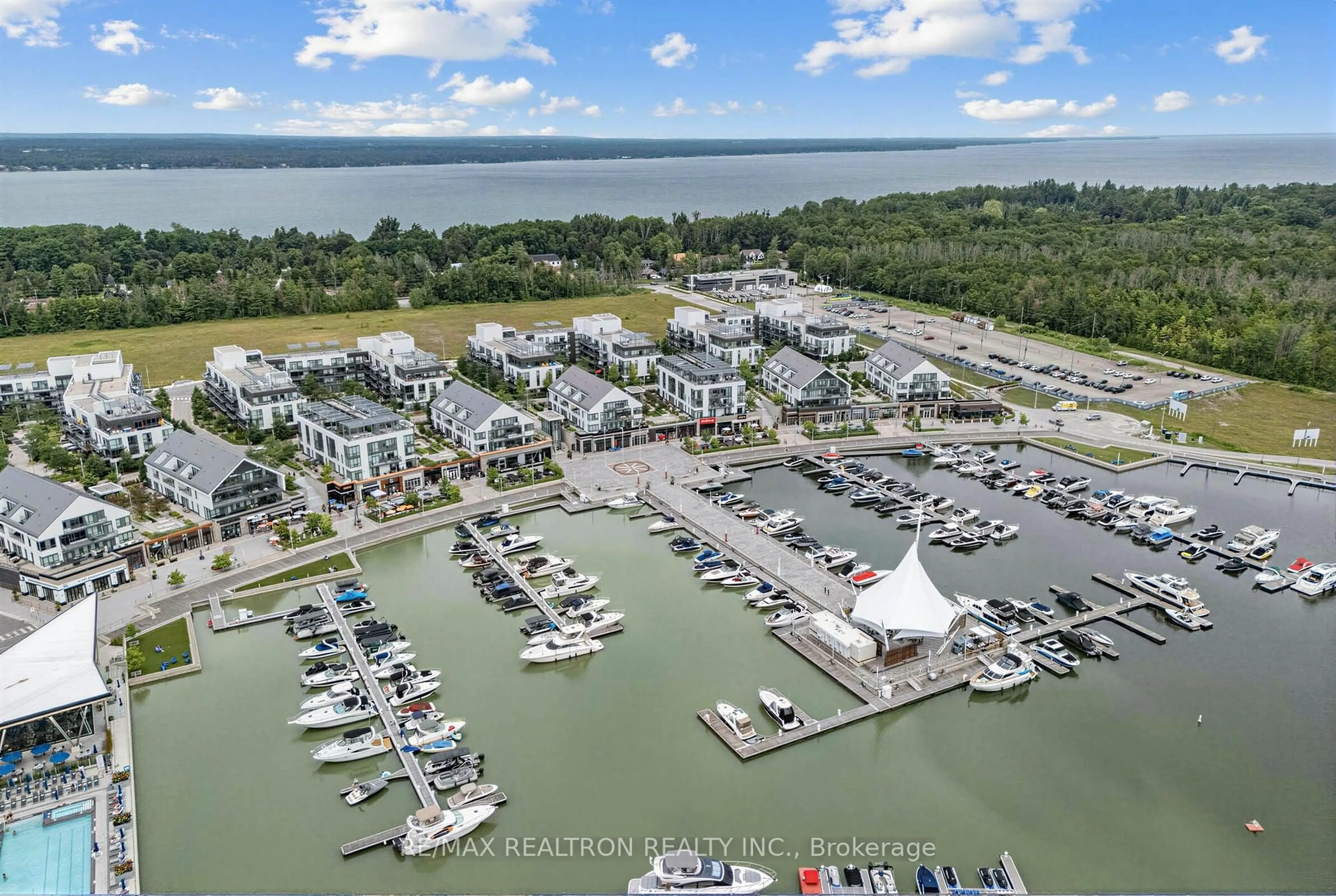 A pic from outside/outdoor area/front of a property/back of a property/a pic from drone, water/lake/river/ocean view for 233 Broward Way #8, Innisfil Ontario L9S 0M5
