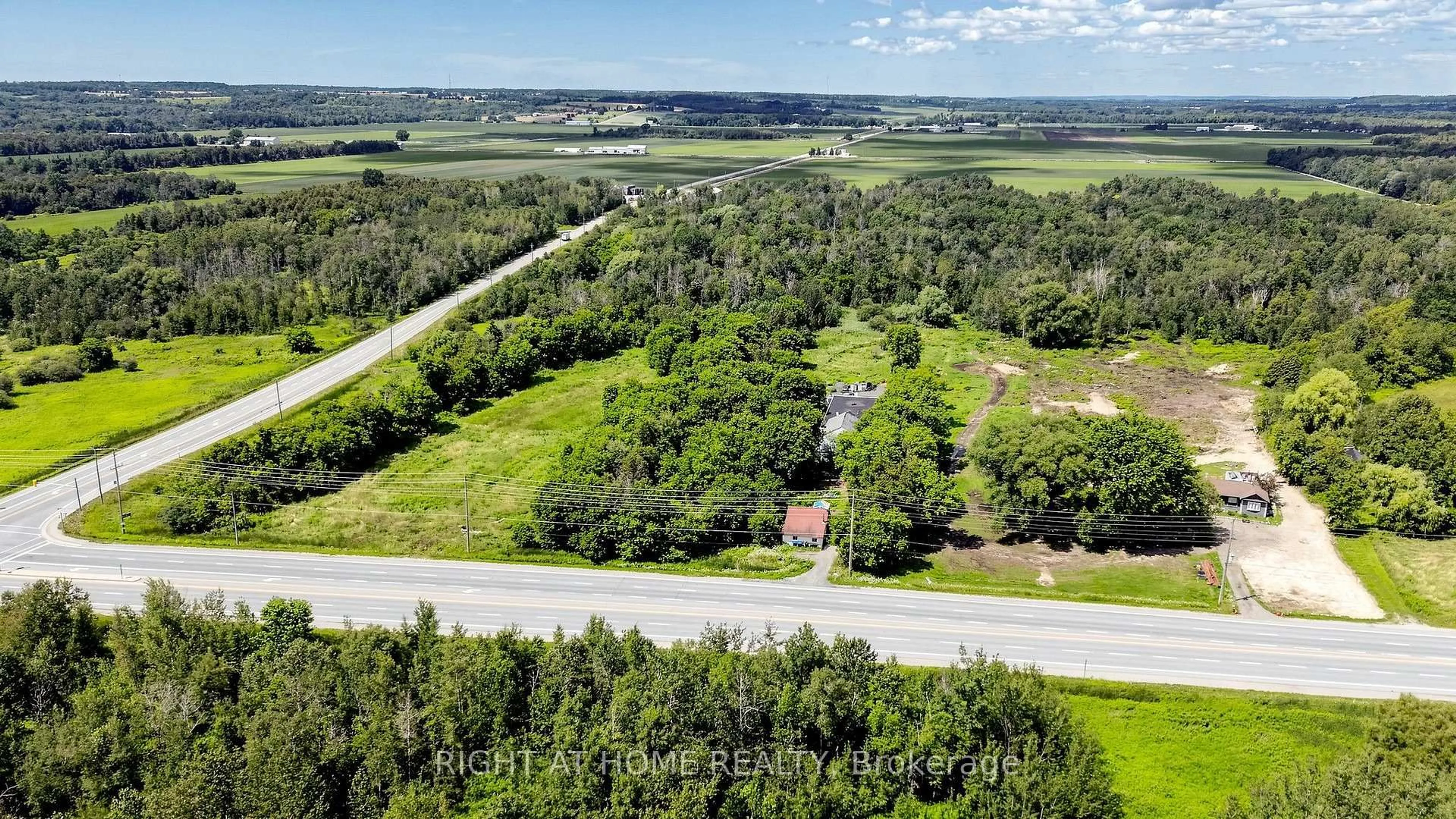 A pic from outside/outdoor area/front of a property/back of a property/a pic from drone, forest/trees view for 2884 COUNTY RD 89 Rd, Innisfil Ontario L0L 1L0