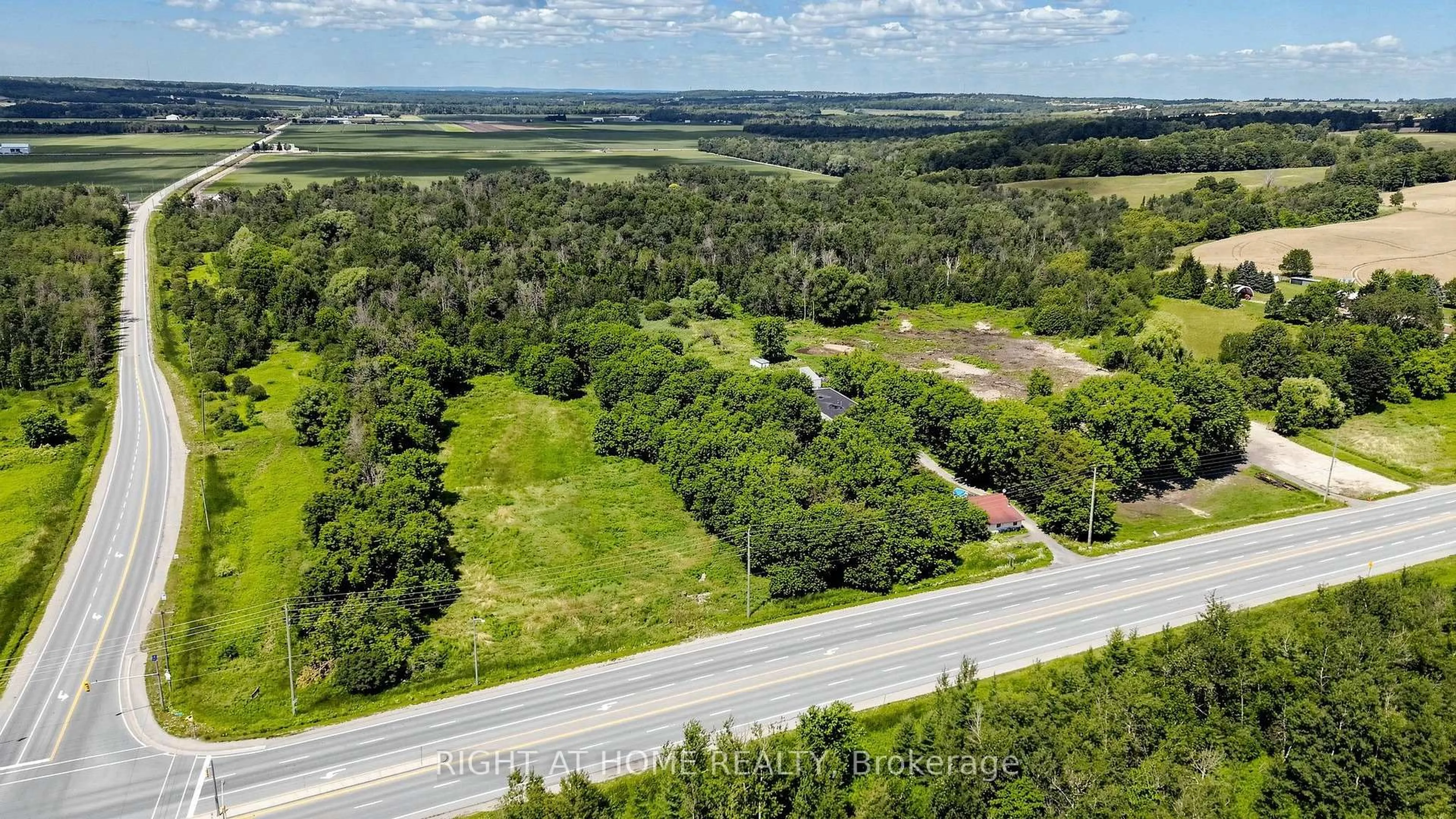 A pic from outside/outdoor area/front of a property/back of a property/a pic from drone, forest/trees view for 2884 COUNTY RD 89 Rd, Innisfil Ontario L0L 1L0