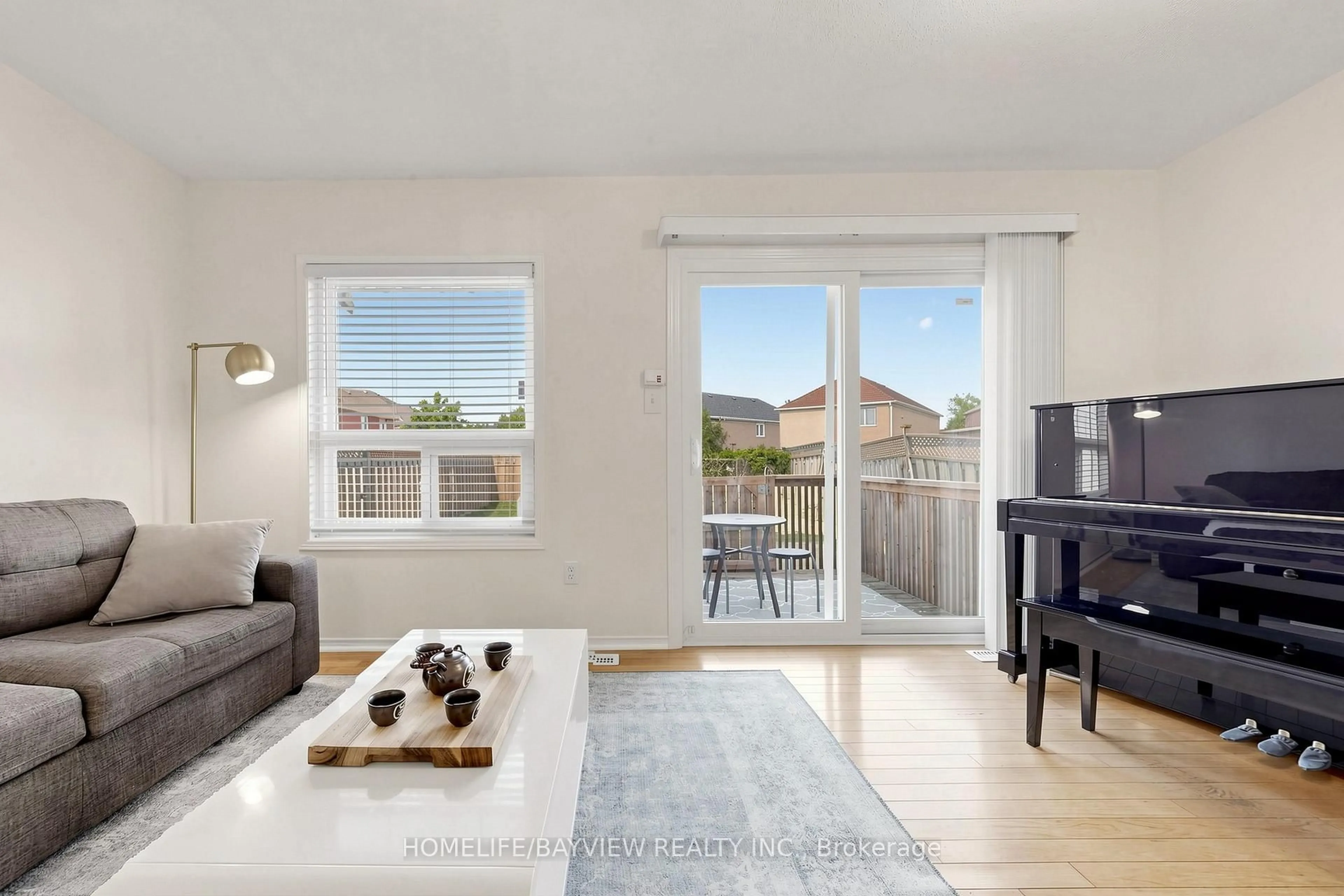 Living room with furniture, wood/laminate floor for 133 Laird Dr, Markham Ontario L3S 3N7