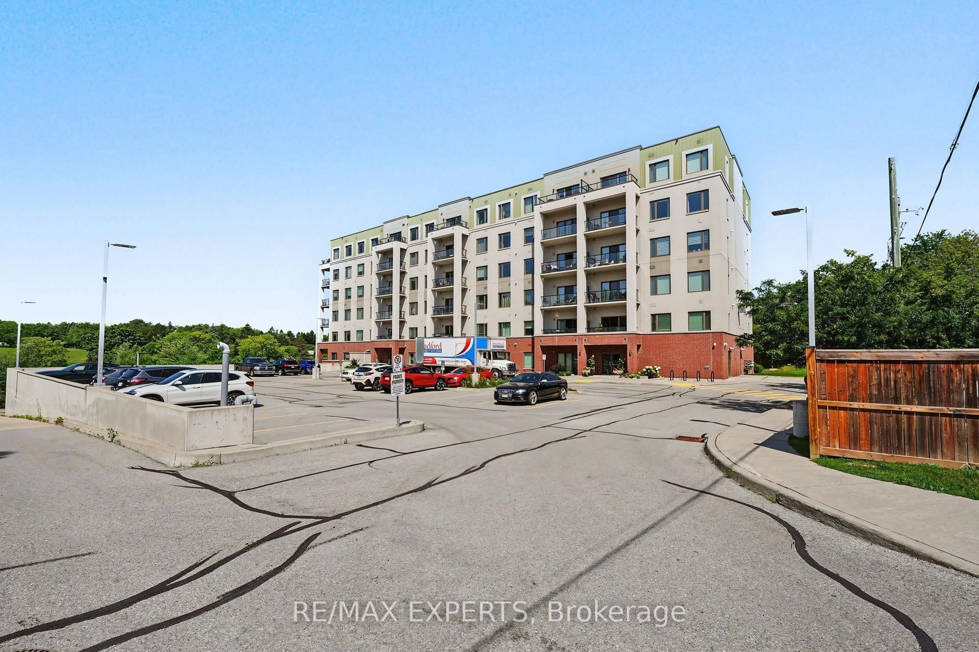 A pic from outside/outdoor area/front of a property/back of a property/a pic from drone, street for 64 Queen St #105, New Tecumseth Ontario L0G 1W0