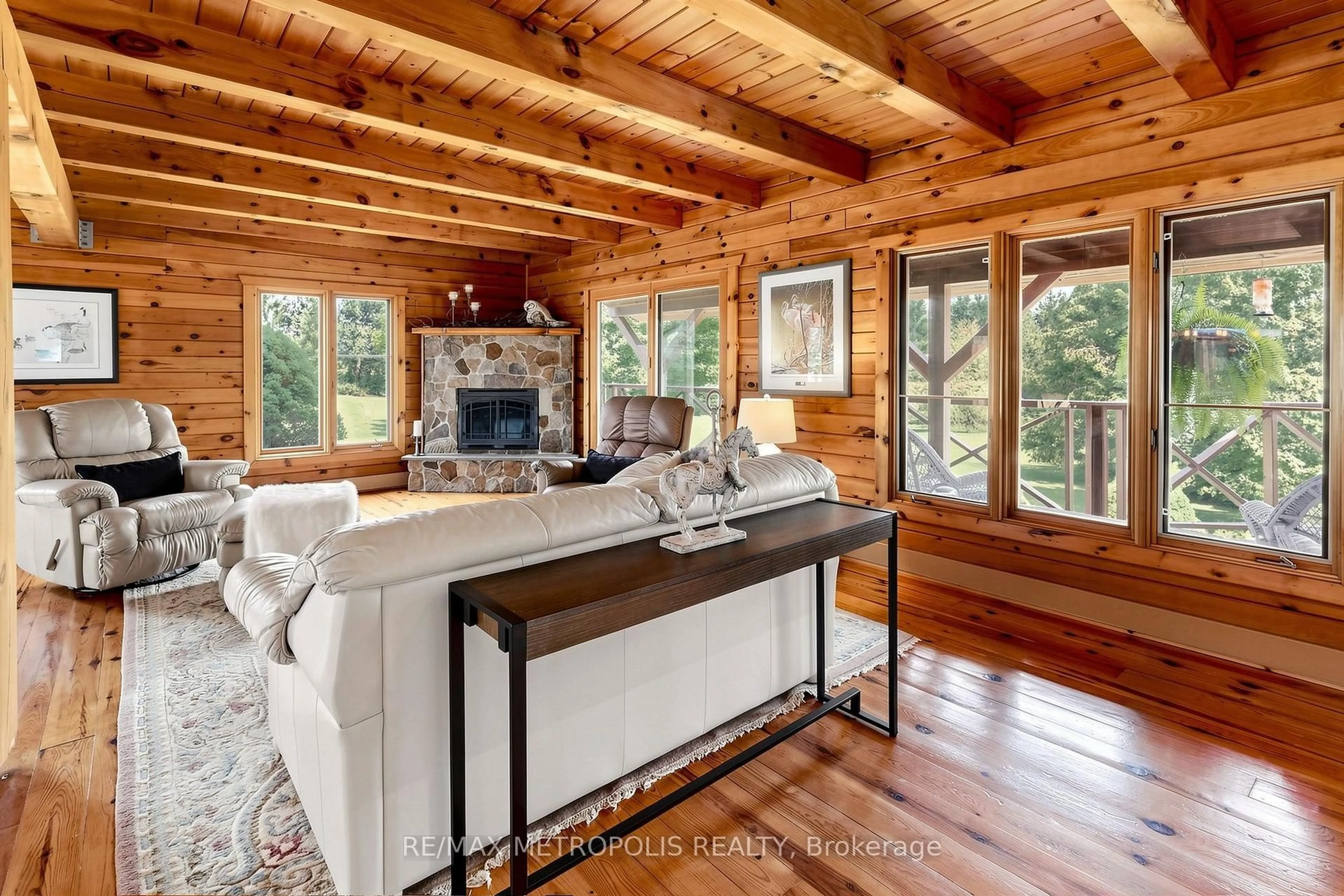 Living room with furniture, wood/laminate floor for 11590 Side Road 17, Brock Ontario L0C 1H0