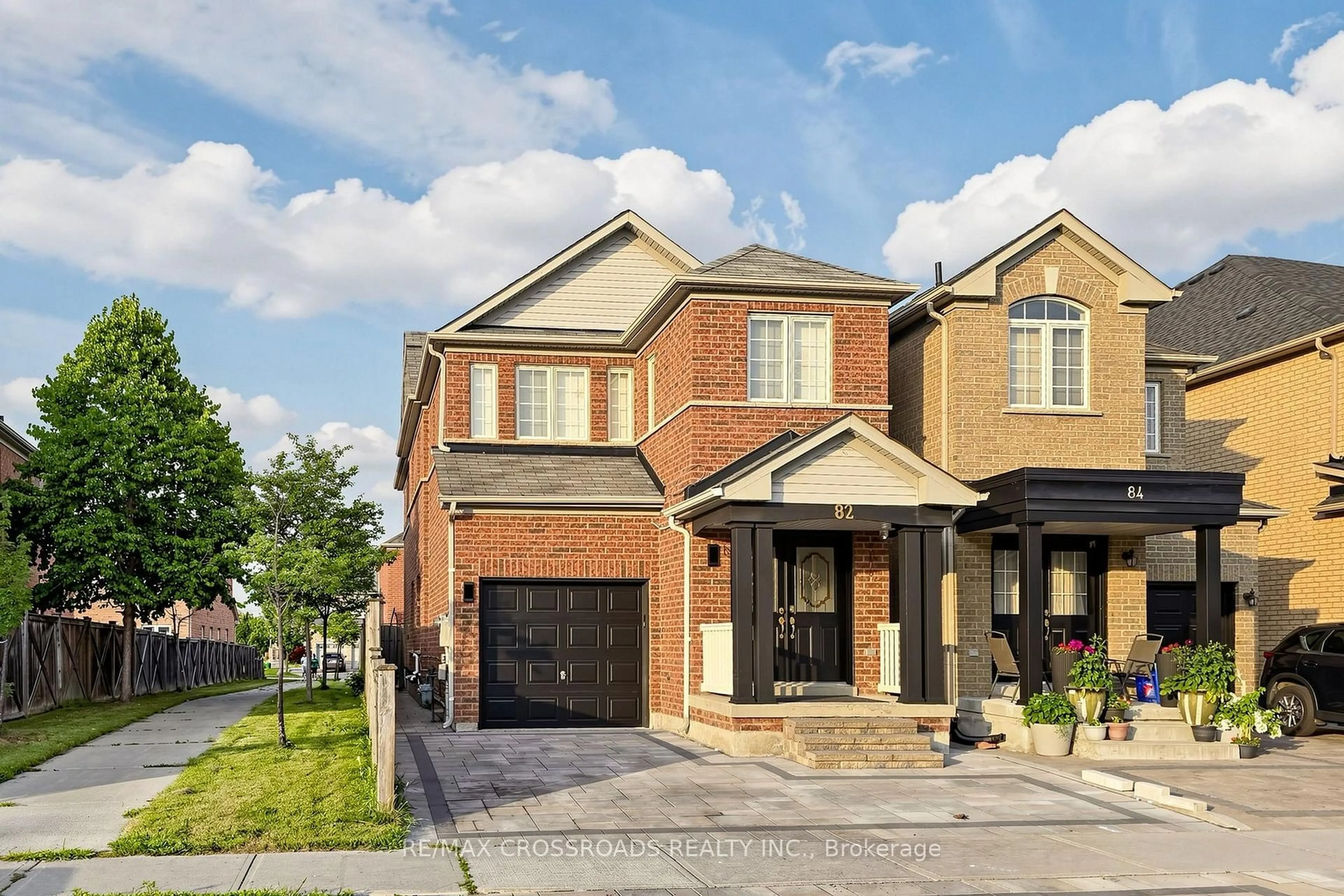 Home with brick exterior material, street for 82 Jack Monkman Cres, Markham Ontario L3S 0A4