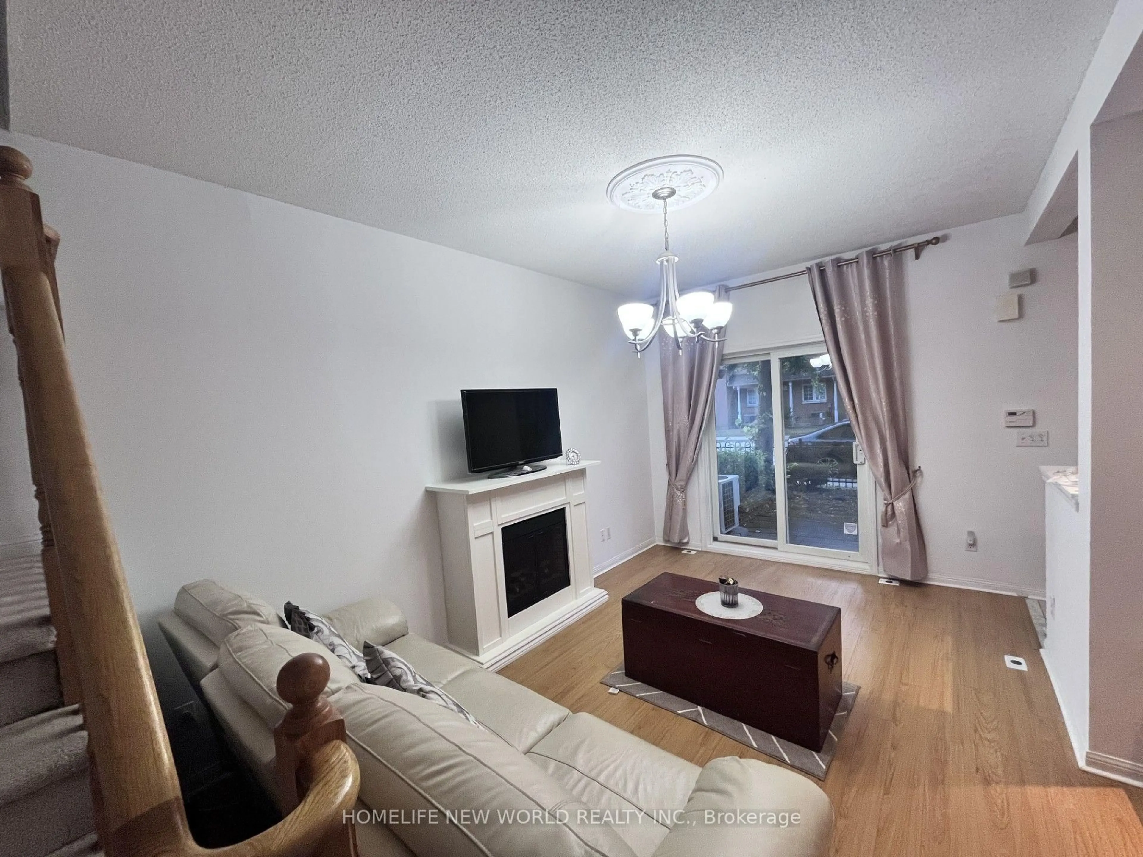 Living room with furniture, wood/laminate floor for 21 St. Moritz Way #12, Markham Ontario L3R 4G4