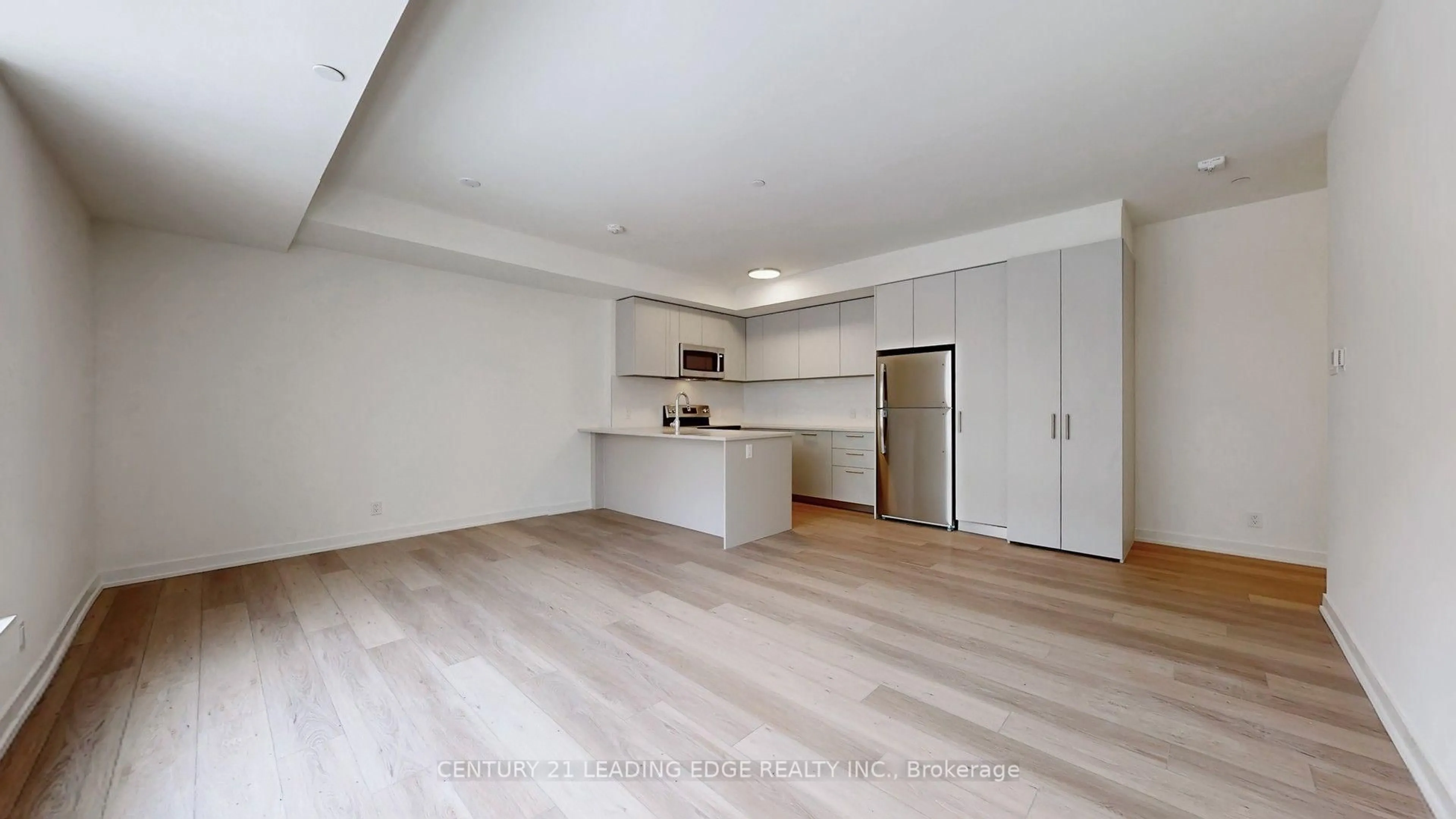 Open concept kitchen, wood/laminate floor for 101 Cathedral High St #224, Markham Ontario L6C 0P1