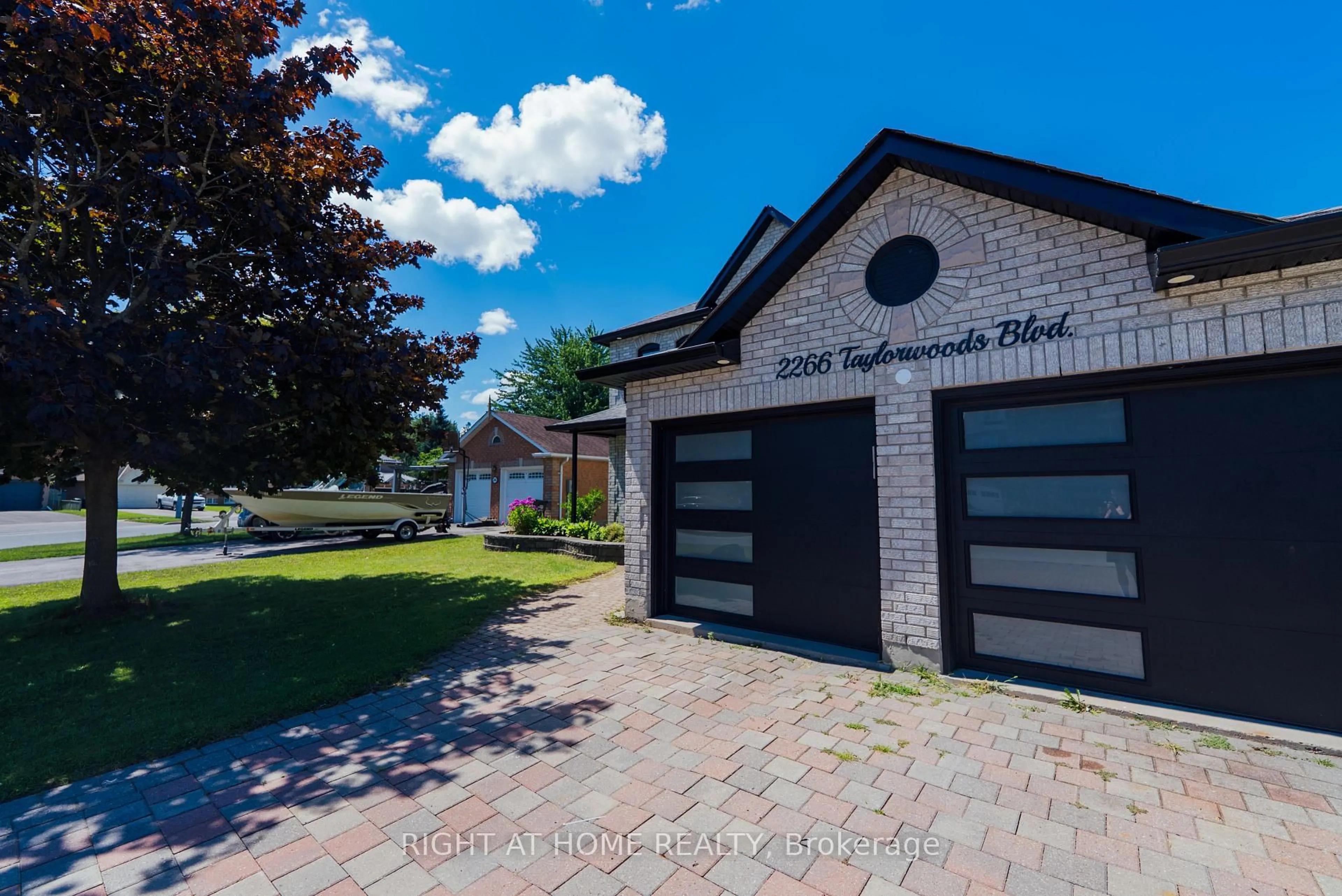 Home with brick exterior material, street for 2266 Taylorwoods Blvd, Innisfil Ontario L9S 2E6