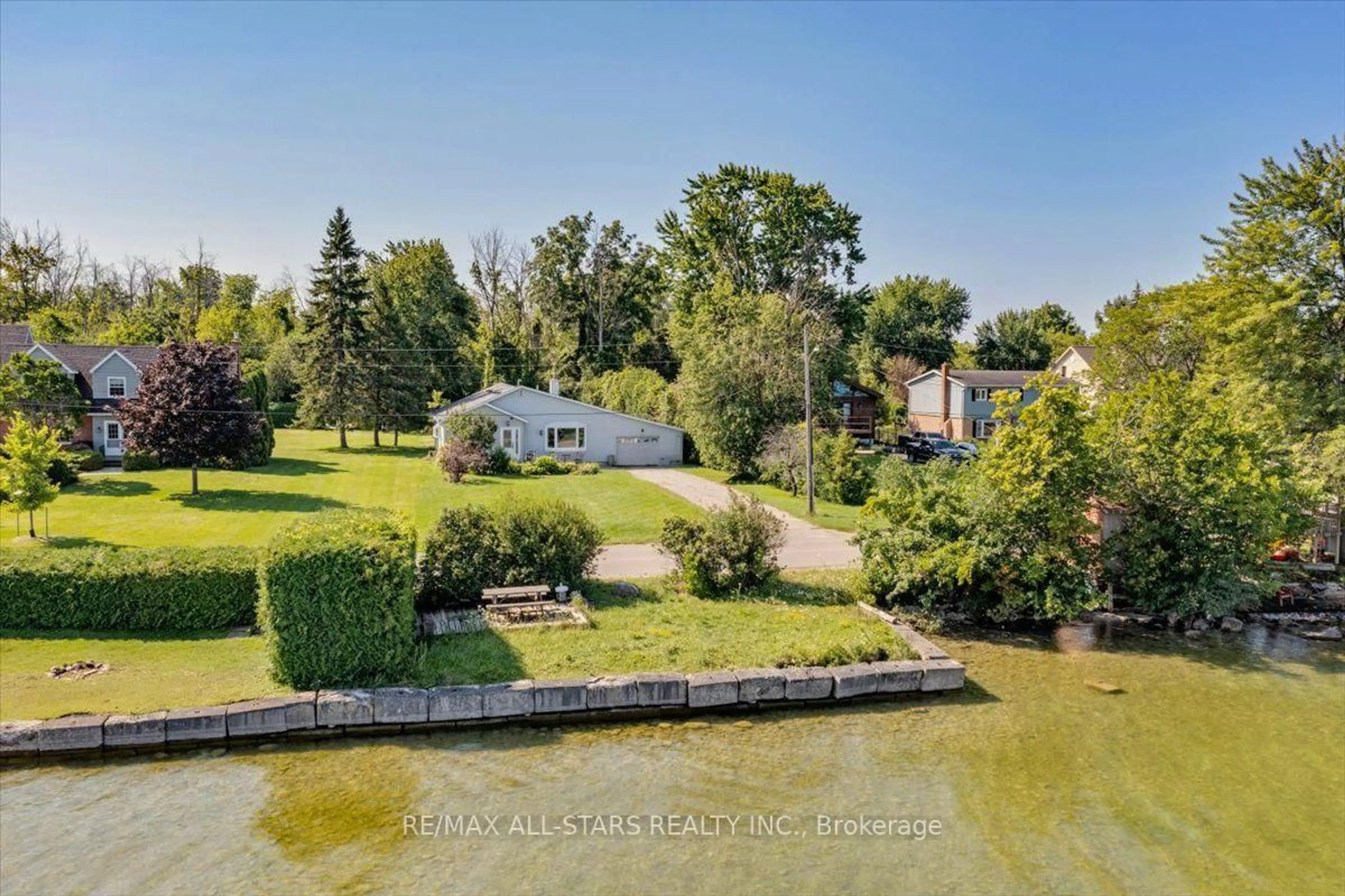 A pic from outside/outdoor area/front of a property/back of a property/a pic from drone, water/lake/river/ocean view for 35 Lake Dr, Georgina Ontario L4P 3E9