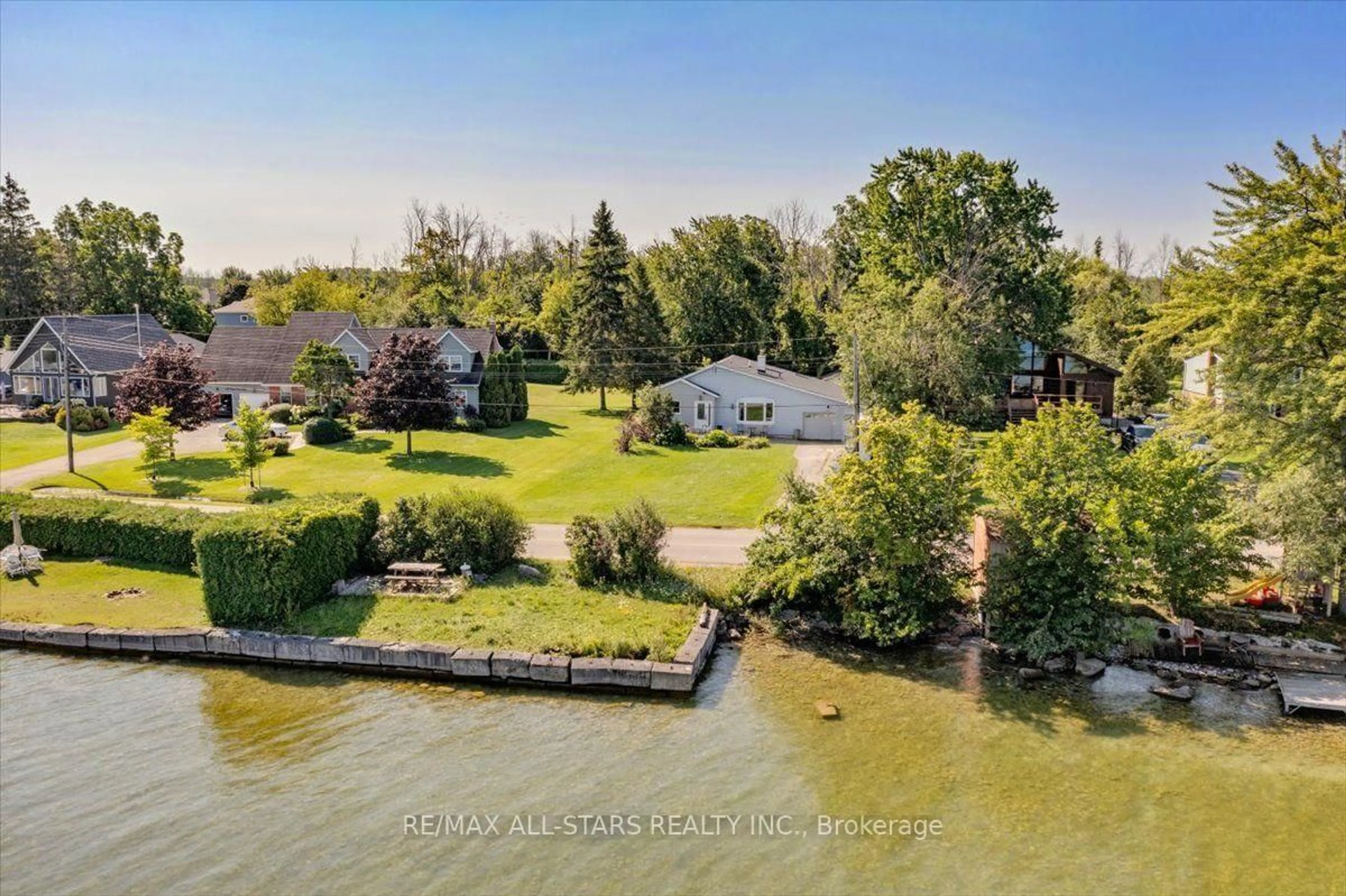 A pic from outside/outdoor area/front of a property/back of a property/a pic from drone, water/lake/river/ocean view for 35 Lake Dr, Georgina Ontario L4P 3E9