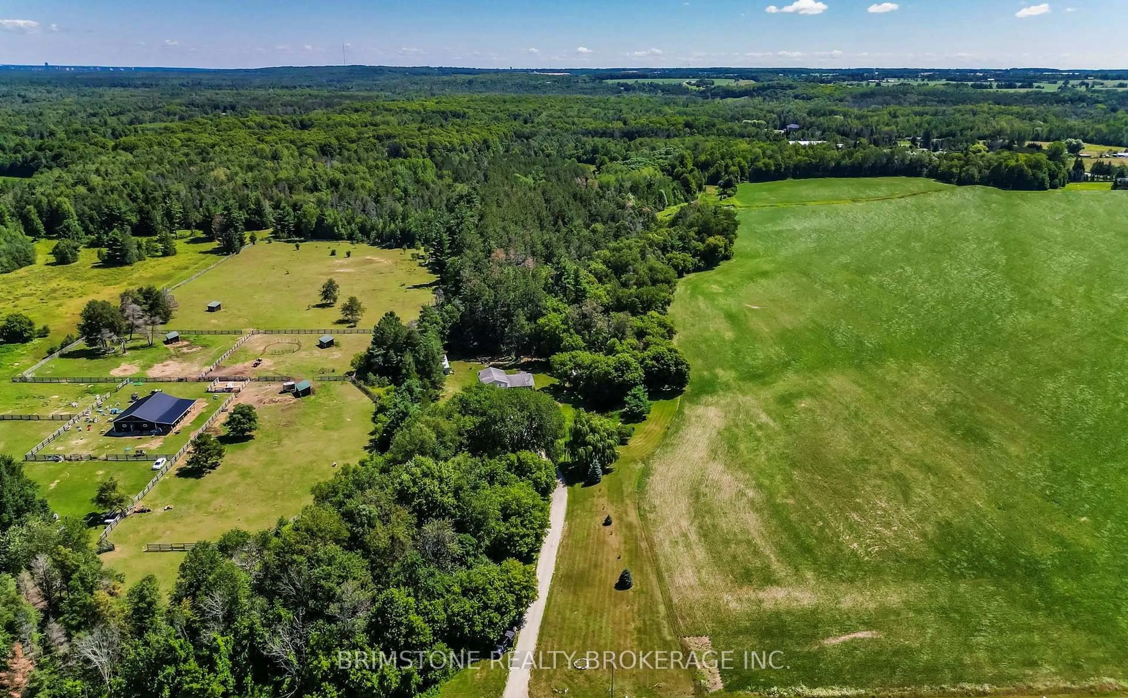 A pic from outside/outdoor area/front of a property/back of a property/a pic from drone, forest/trees view for 8231 56 County Rd, Essa Ontario L0M 1T0
