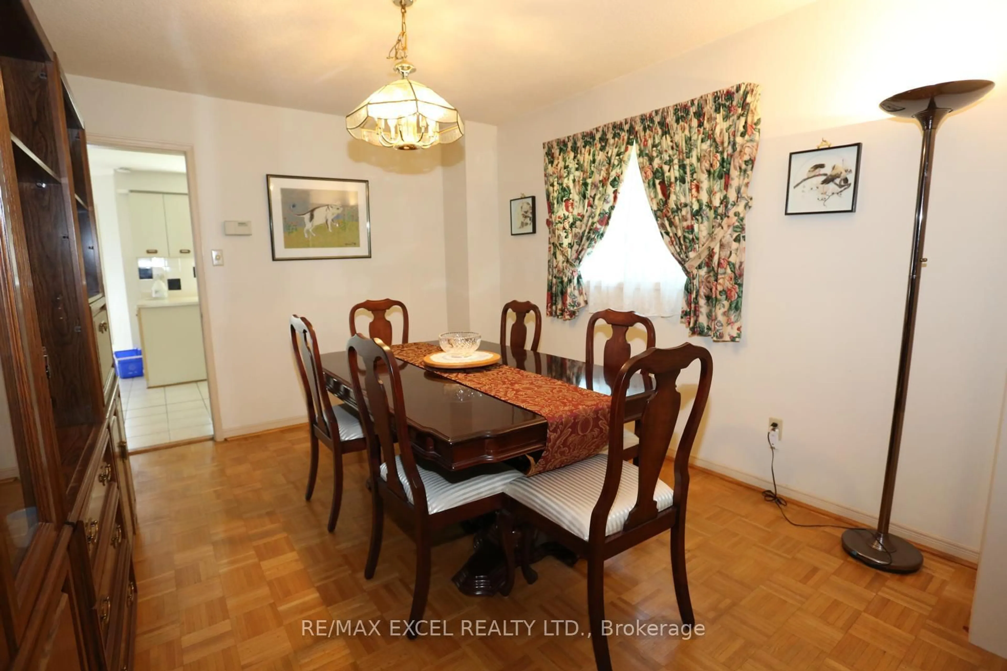 Dining room, wood/laminate floor for 93 Olivewood Dr, Markham Ontario L3S 3E2