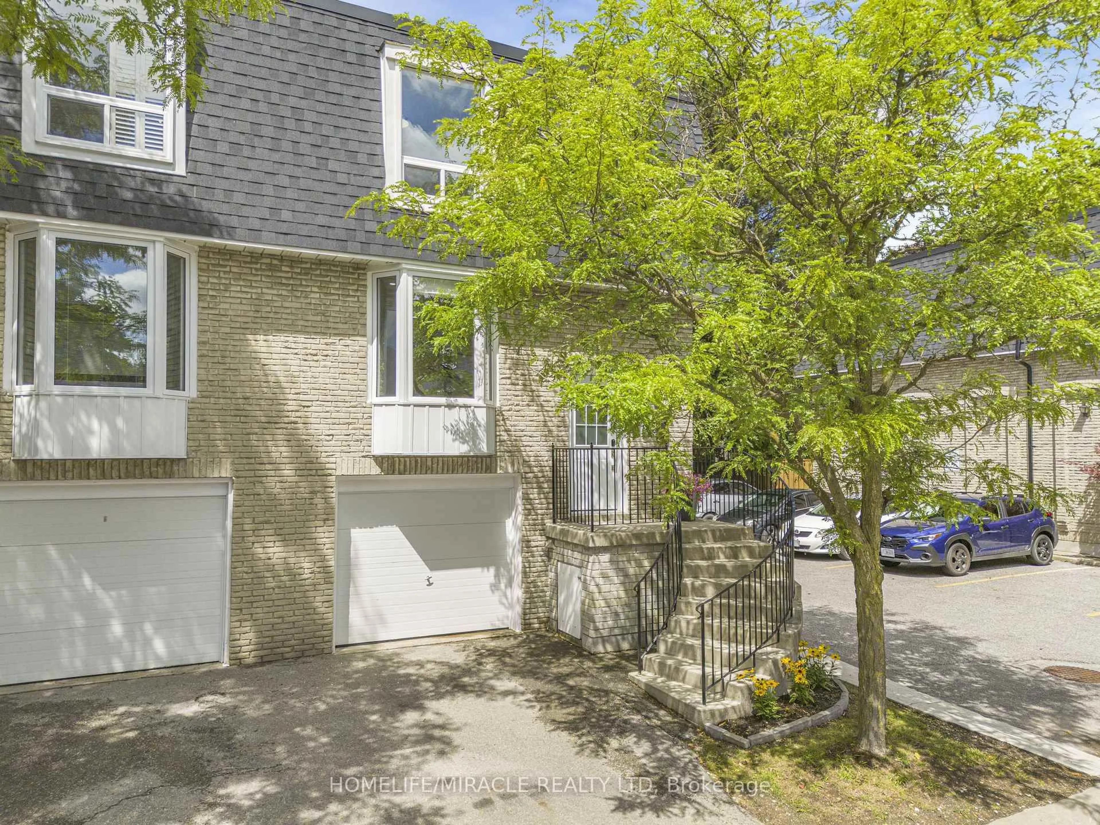 A pic from outside/outdoor area/front of a property/back of a property/a pic from drone, street for 210 Royal Orchard Blvd #51, Markham Ontario L3T 3E7