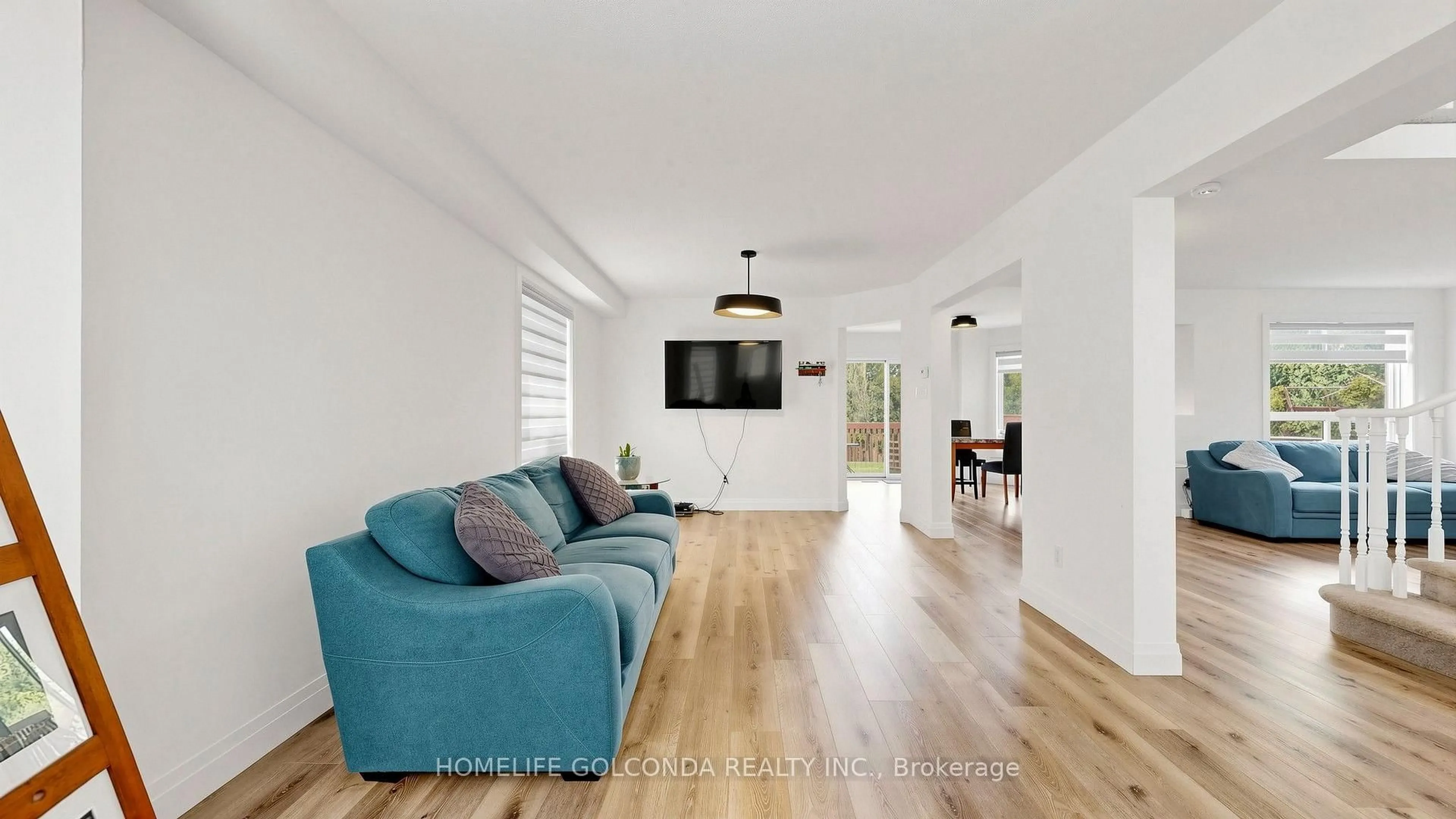 Living room with furniture, wood/laminate floor for 1304 Vincent Cres, Innisfil Ontario L9S 1Z8