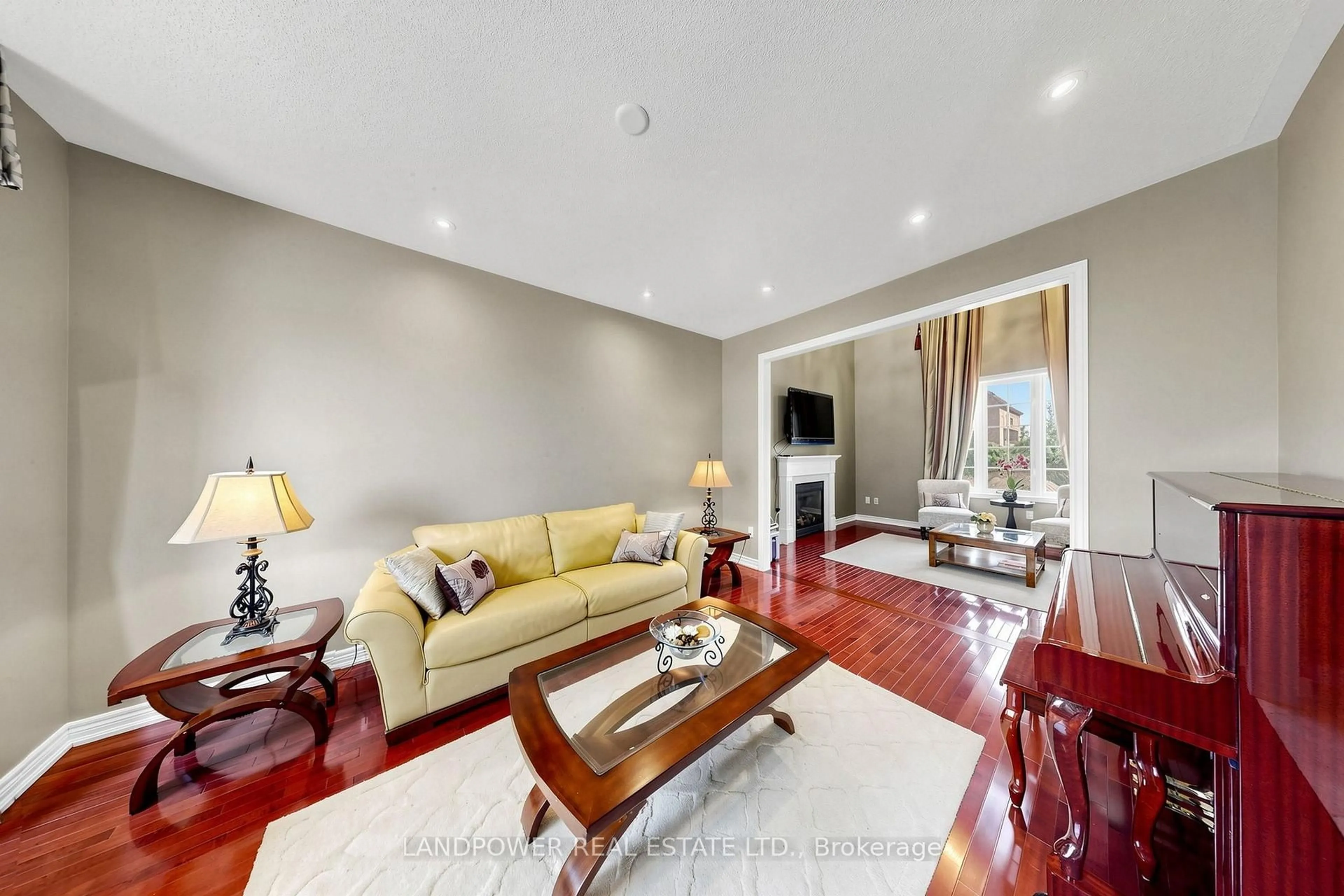 Living room with furniture, wood/laminate floor for 25 Reflection Rd, Markham Ontario L6C 0A1
