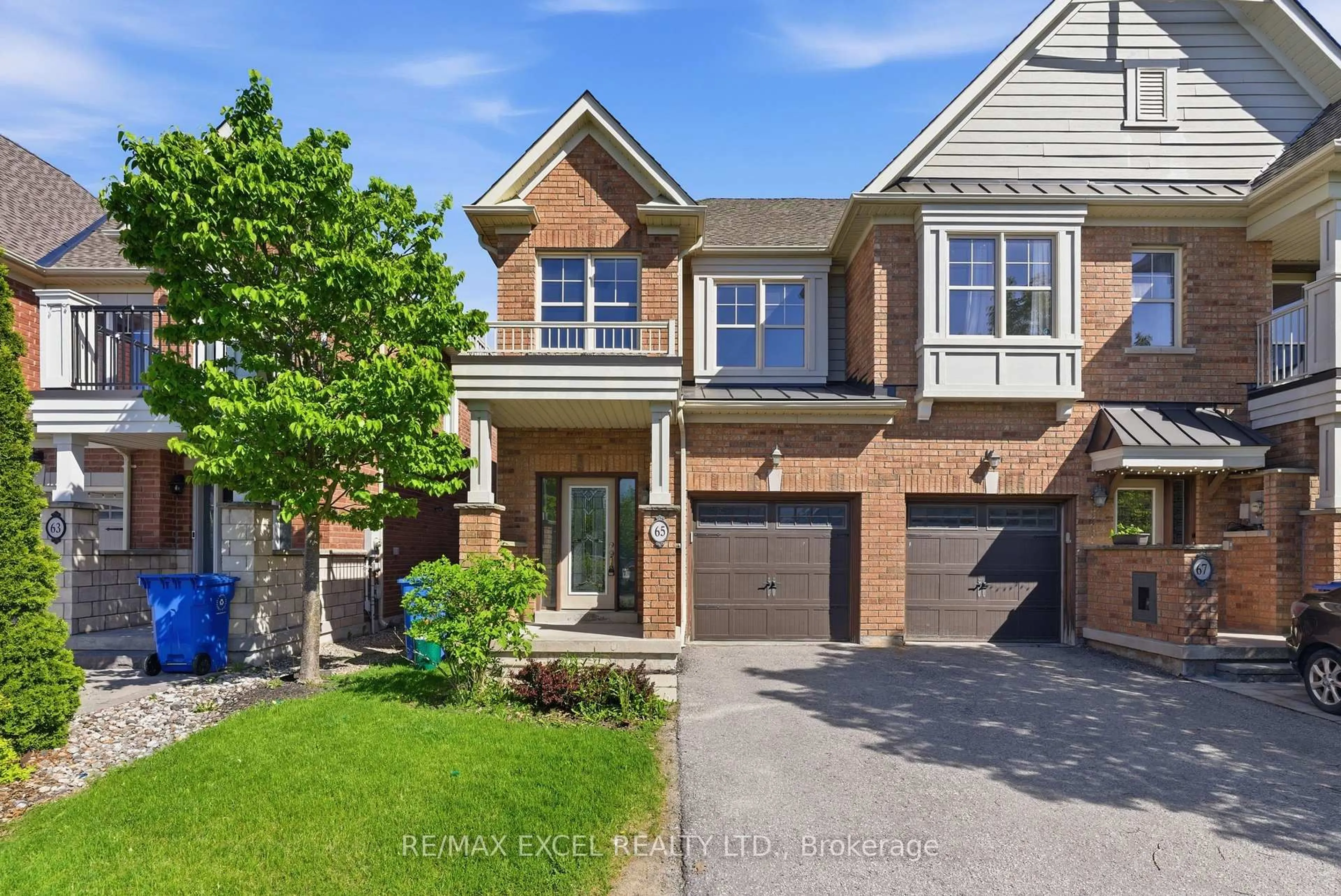 Home with brick exterior material, street for 65 Northwest Passage, Whitchurch-Stouffville Ontario L4A 0T2
