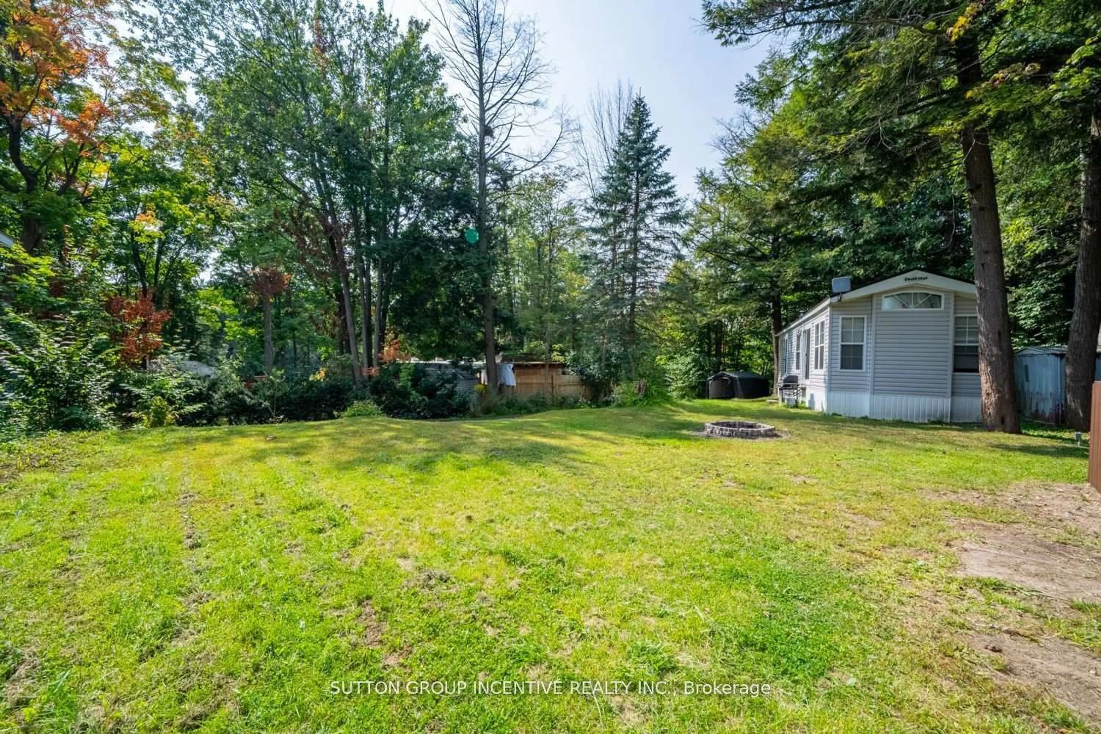 A pic from outside/outdoor area/front of a property/back of a property/a pic from drone, forest/trees view for 6047 Highway 89 #51, New Tecumseth Ontario L9R 2G2