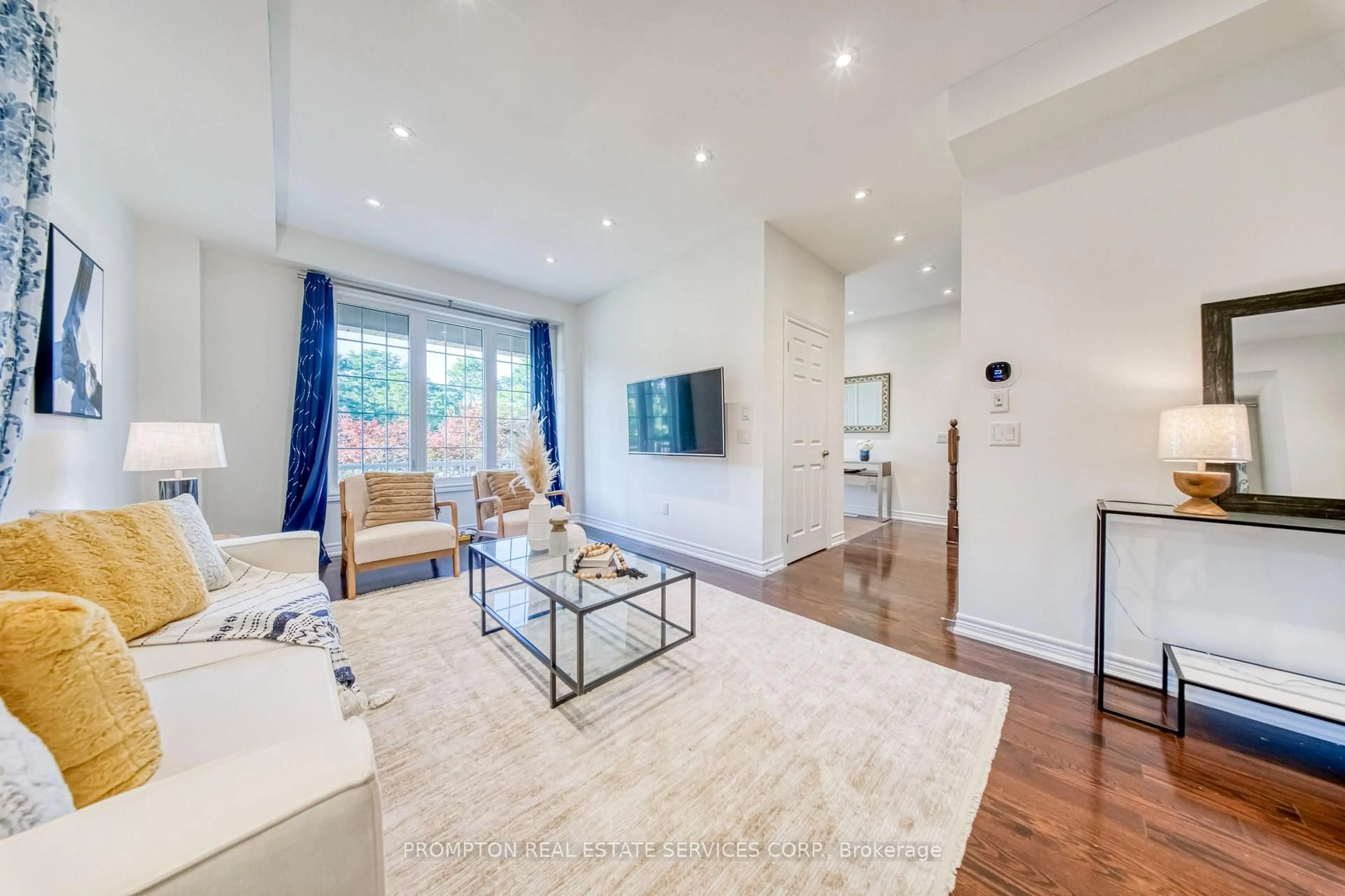 Living room with furniture, wood/laminate floor for 2762 Donald Cousens Pkwy, Markham Ontario L6B 0X8