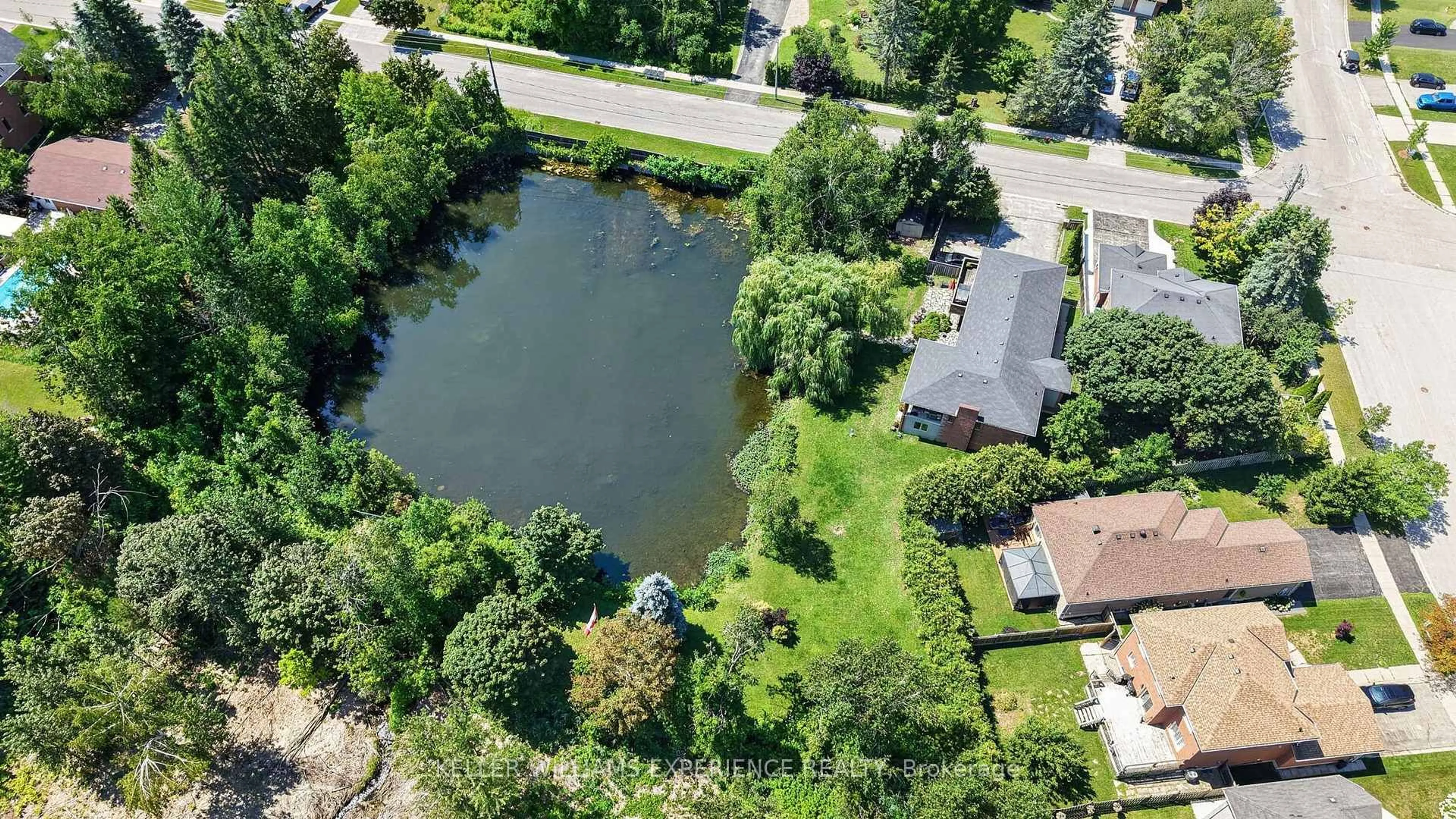 A pic from outside/outdoor area/front of a property/back of a property/a pic from drone, water/lake/river/ocean view for 2235 Adullam Ave, Innisfil Ontario L9S 2B2
