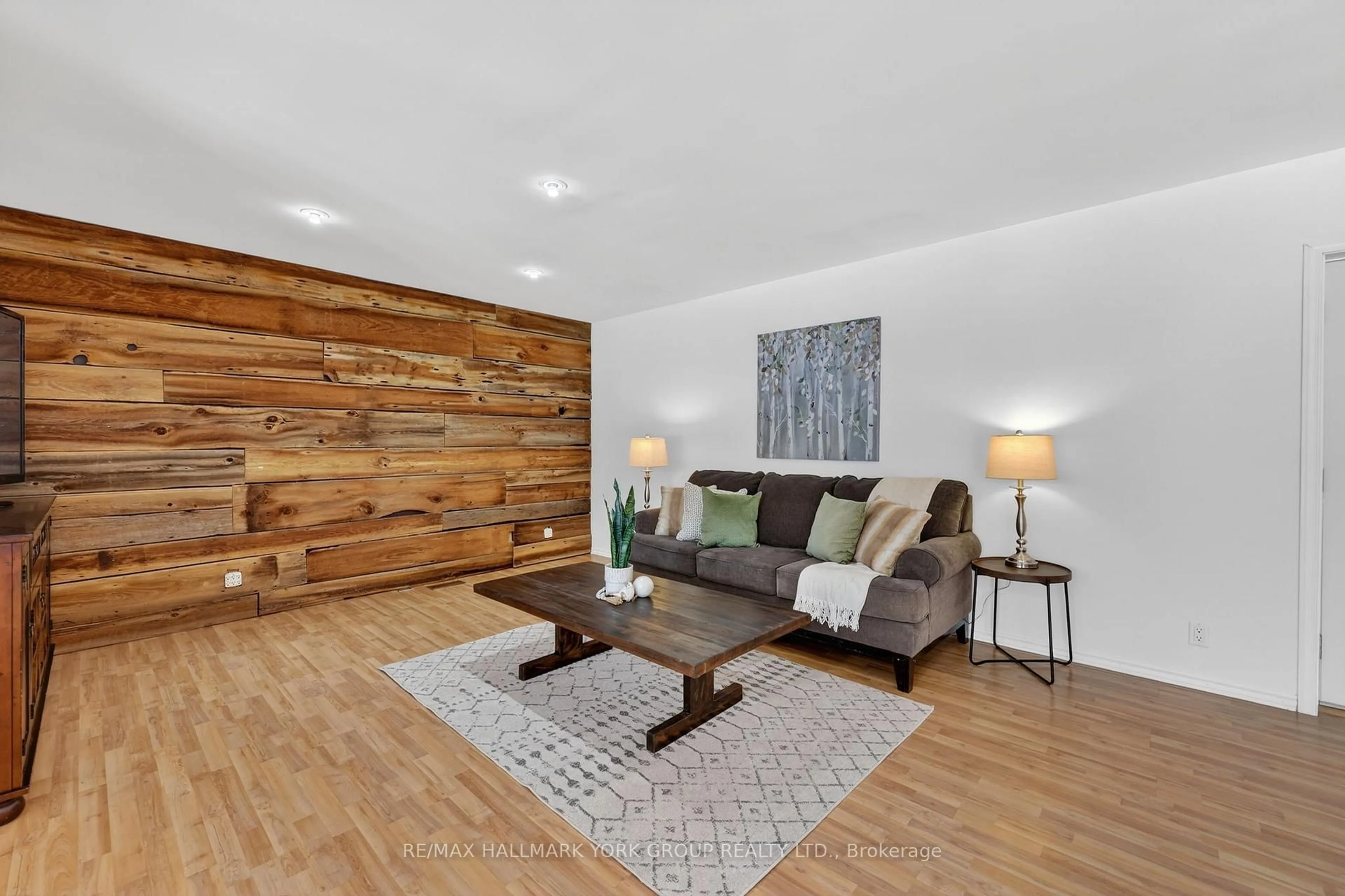 Living room with furniture, wood/laminate floor for 5768 Smith Blvd, Georgina Ontario L0E 1A0