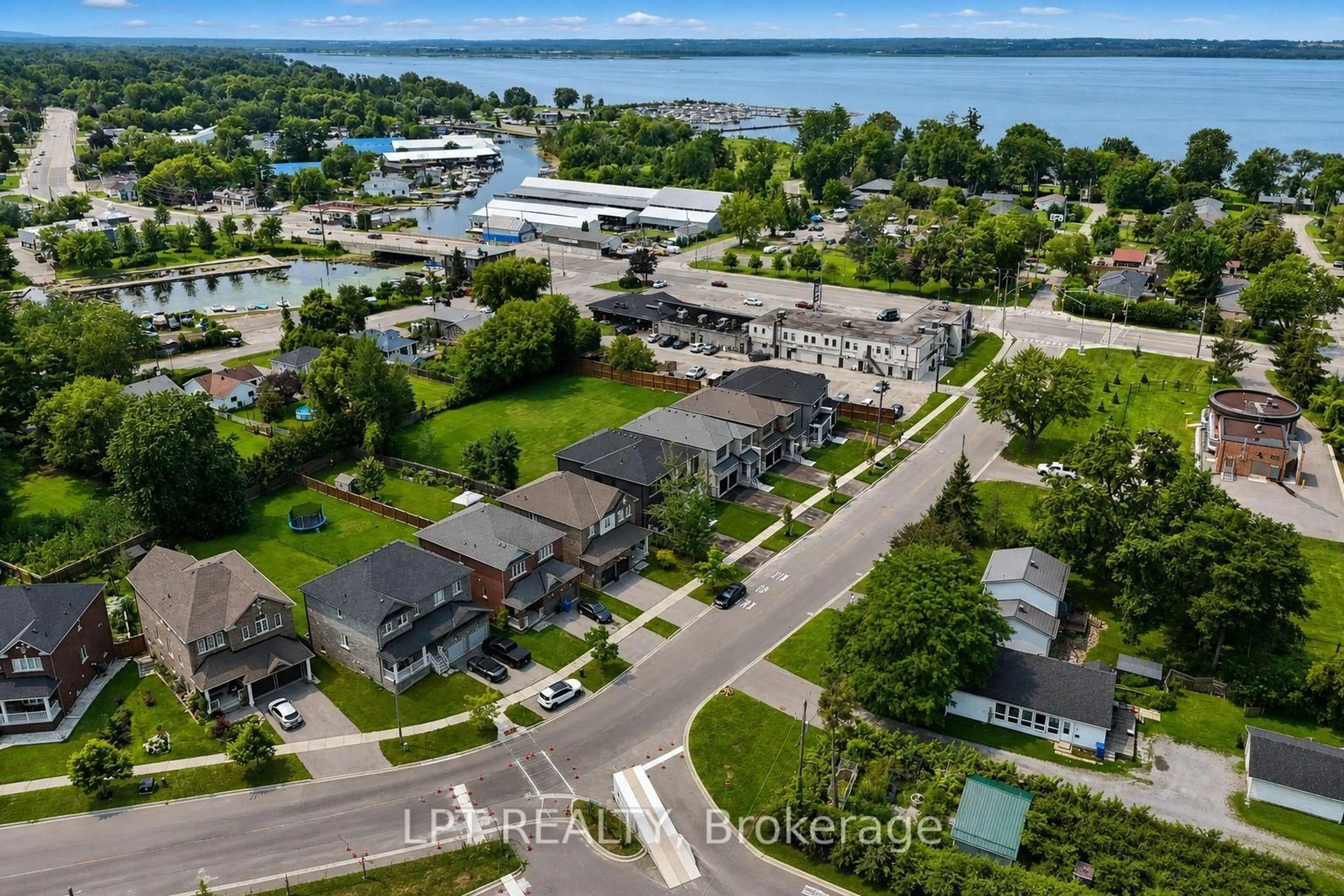 A pic from outside/outdoor area/front of a property/back of a property/a pic from drone, water/lake/river/ocean view for 7 Richmond Park Dr, Georgina Ontario L4P 0H2