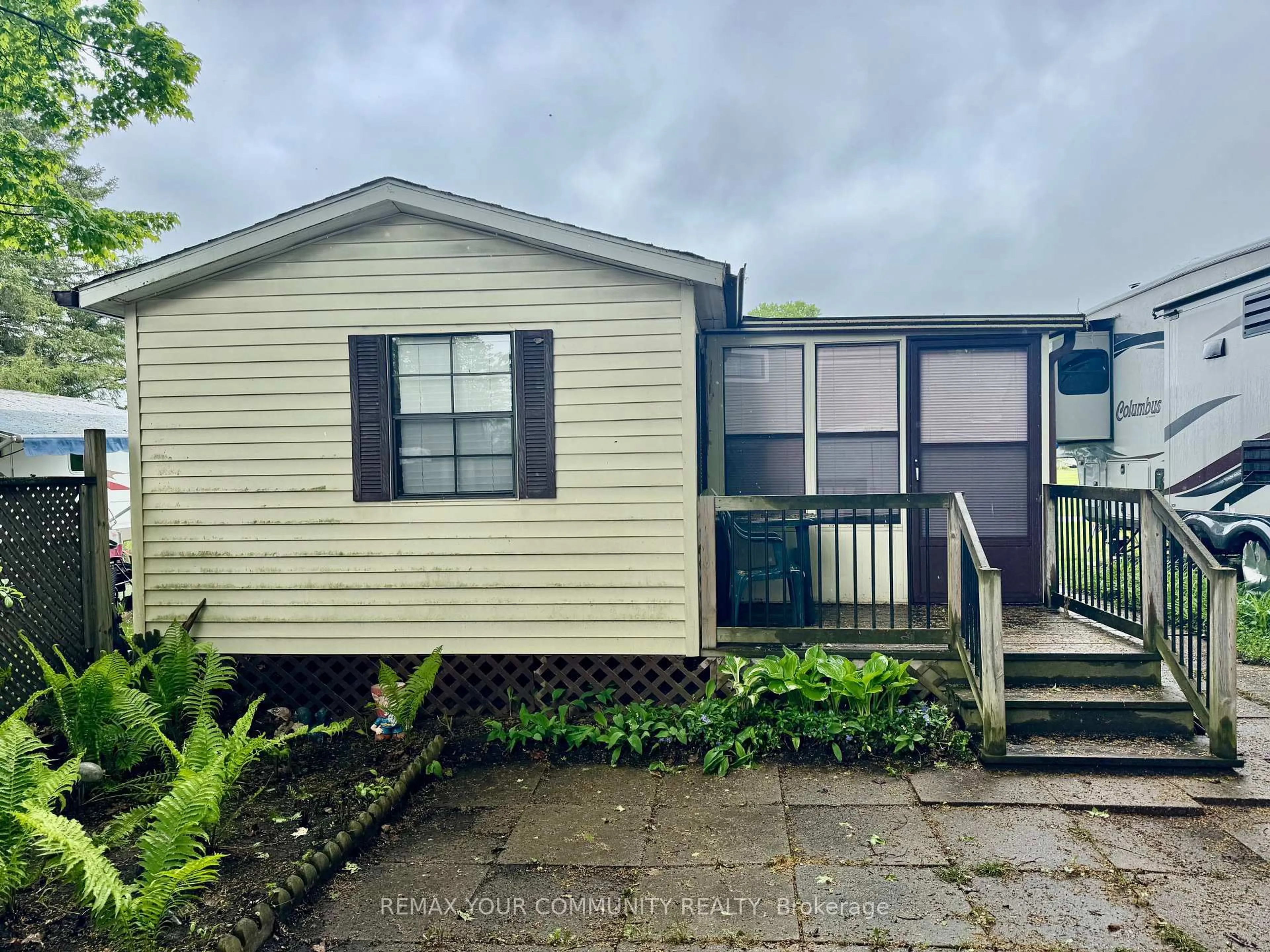 A pic from outside/outdoor area/front of a property/back of a property/a pic from drone, street for 285 Crydermans 42 Sdrd #42, Georgina Ontario L0E 1A0
