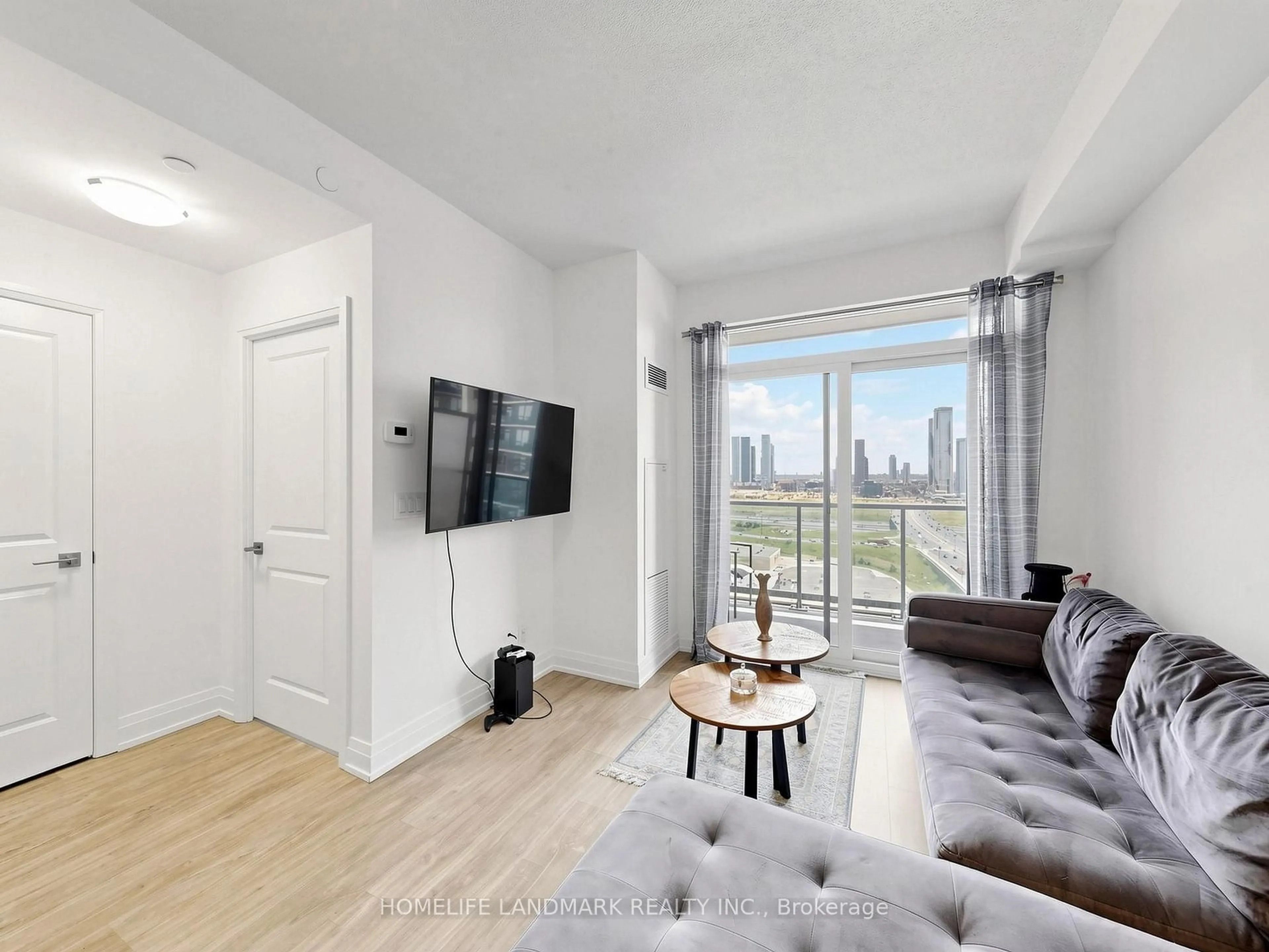 Living room with furniture, wood/laminate floor for 3700 Highway 7 Rd #2212, Vaughan Ontario L4L 0G8