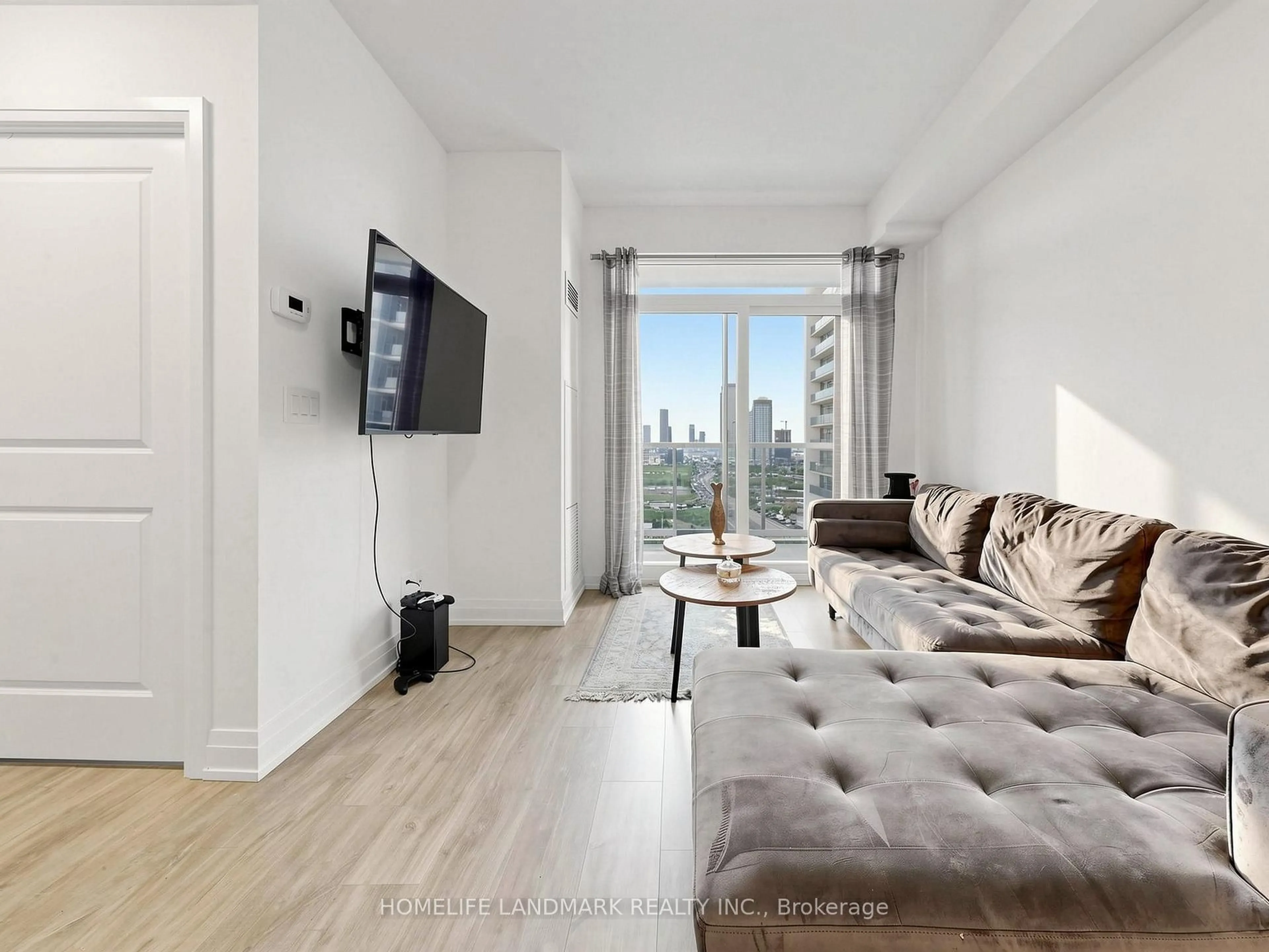 Living room with furniture, wood/laminate floor for 3700 Highway 7 Rd #2212, Vaughan Ontario L4L 0G8