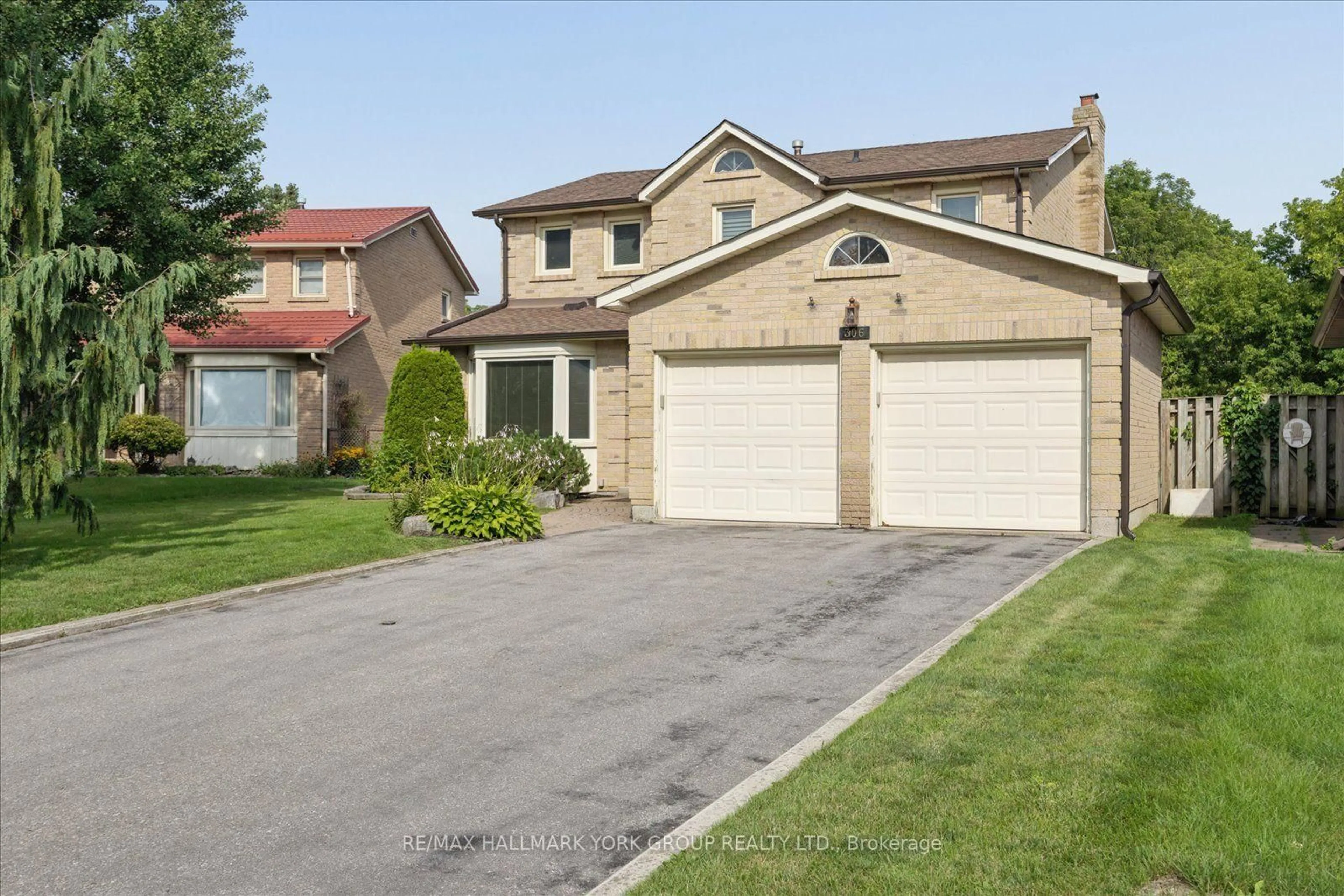 Home with brick exterior material, street for 306 Erin Tr, Newmarket Ontario L3Y 6K1