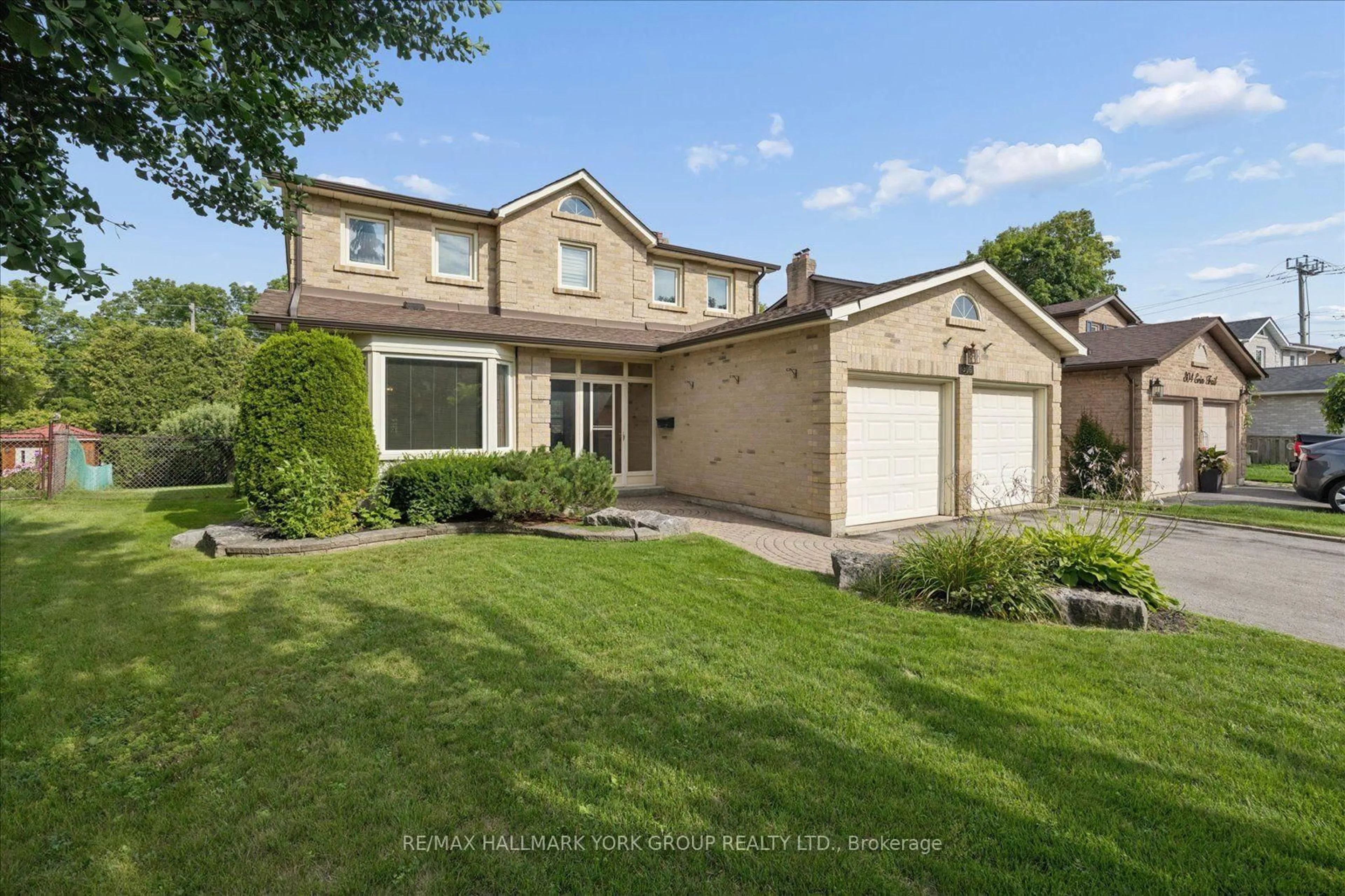 Home with brick exterior material, street for 306 Erin Tr, Newmarket Ontario L3Y 6K1