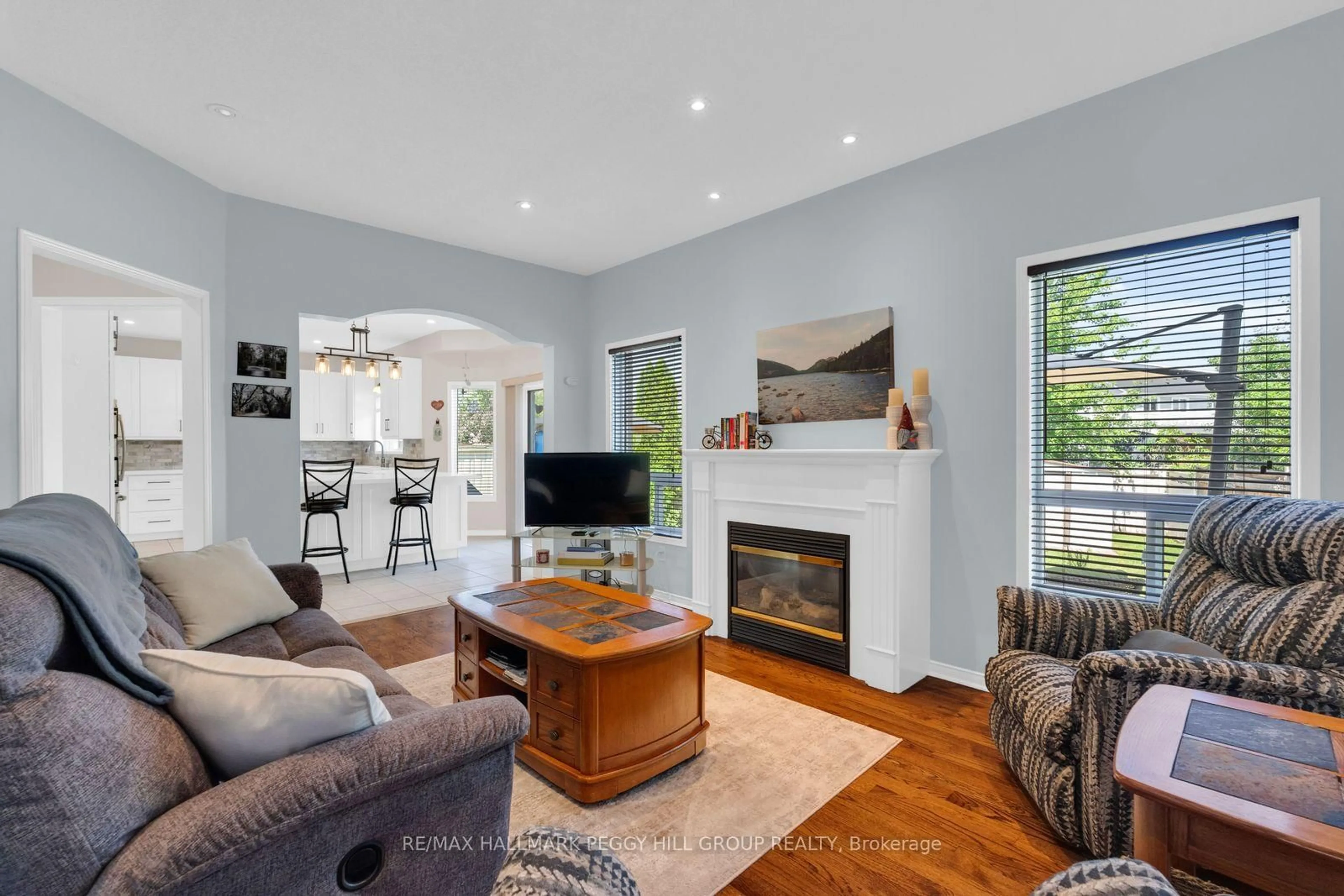 Living room with furniture, wood/laminate floor for 4 Gold Park Gate, Essa Ontario L3W 0C2