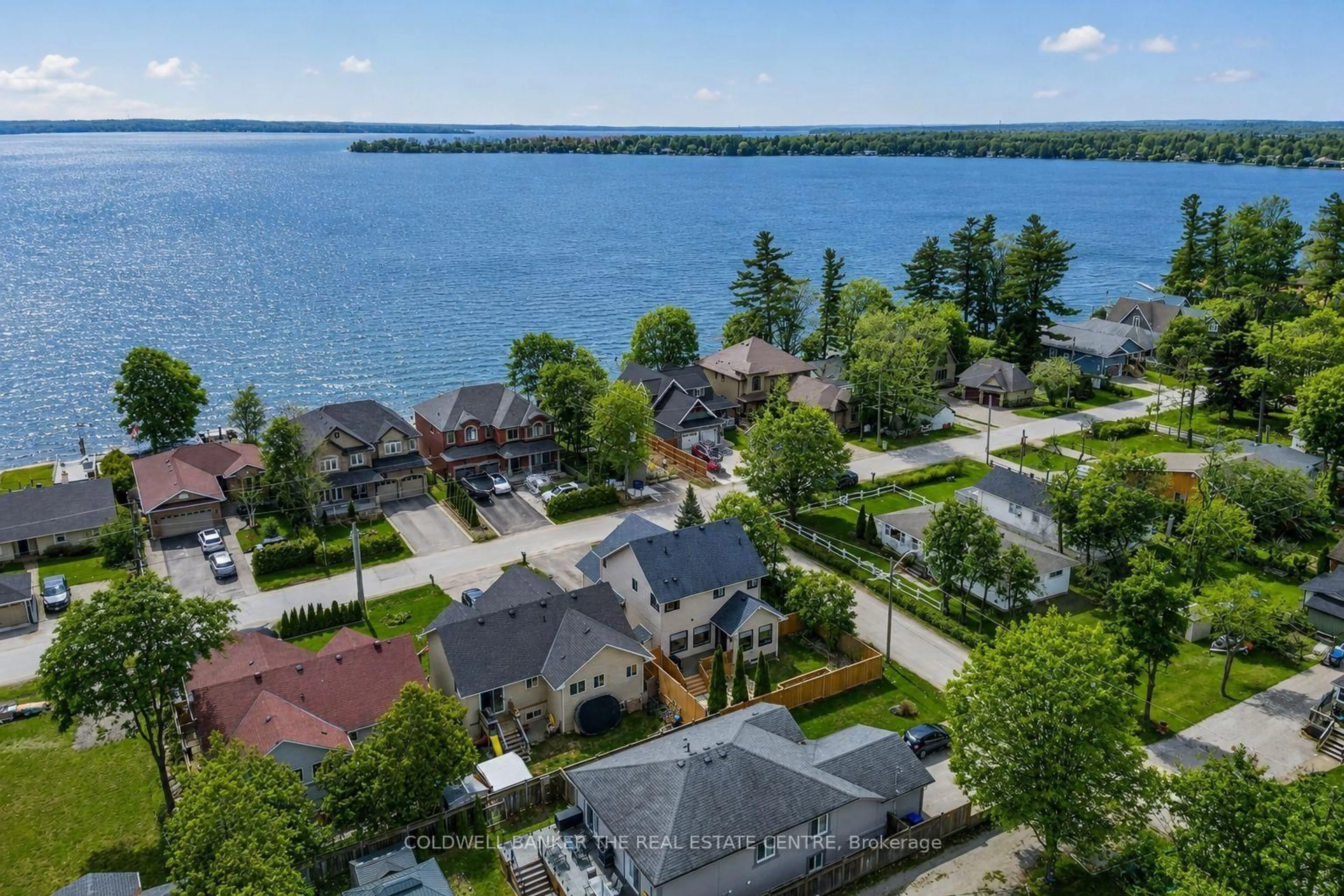 A pic from outside/outdoor area/front of a property/back of a property/a pic from drone, water/lake/river/ocean view for 684 Lakelands Ave, Innisfil Ontario L9S 4E6