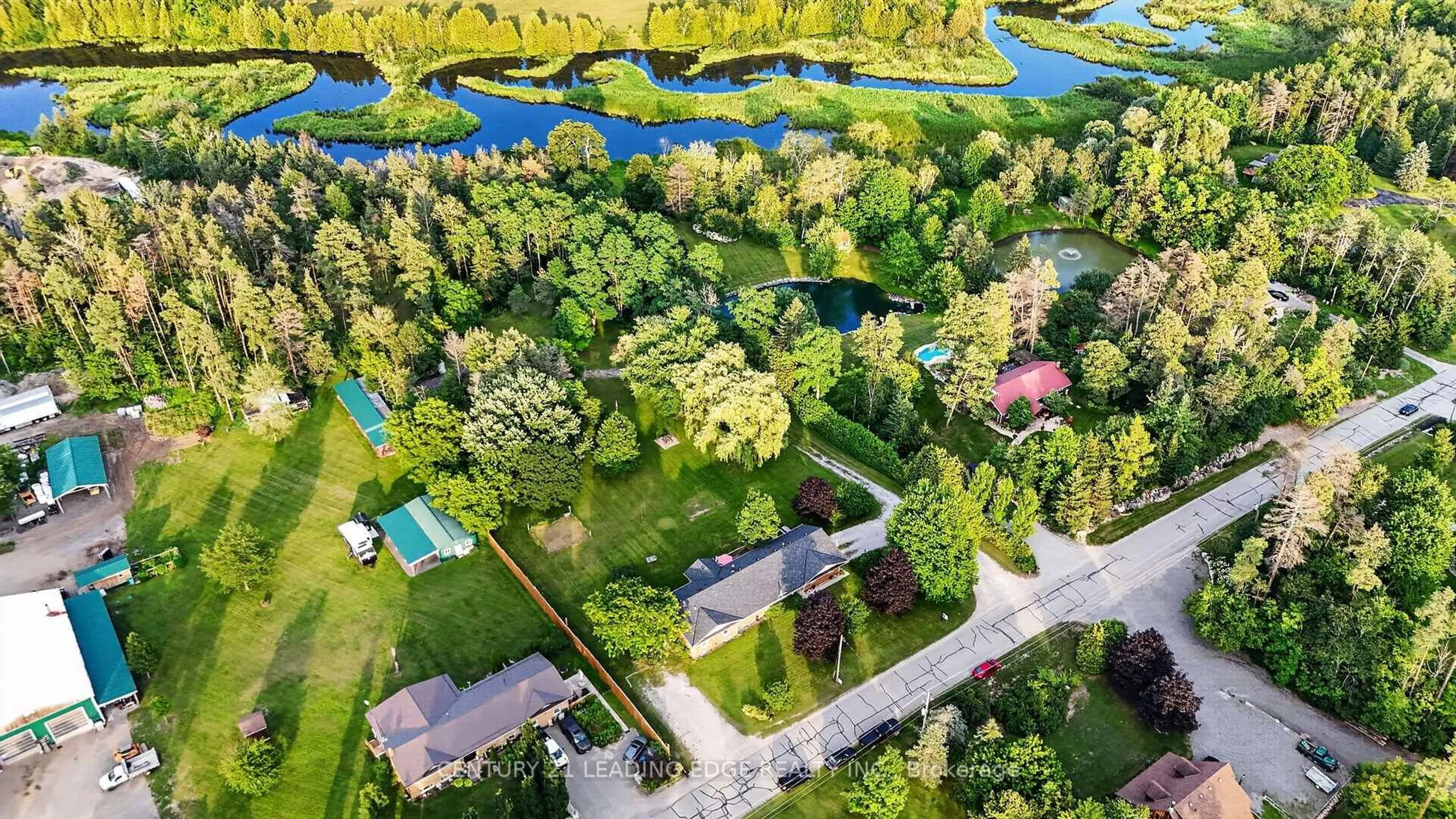 A pic from outside/outdoor area/front of a property/back of a property/a pic from drone, forest/trees view for 23233 Miles Rd, Georgina Ontario L0E 1R0