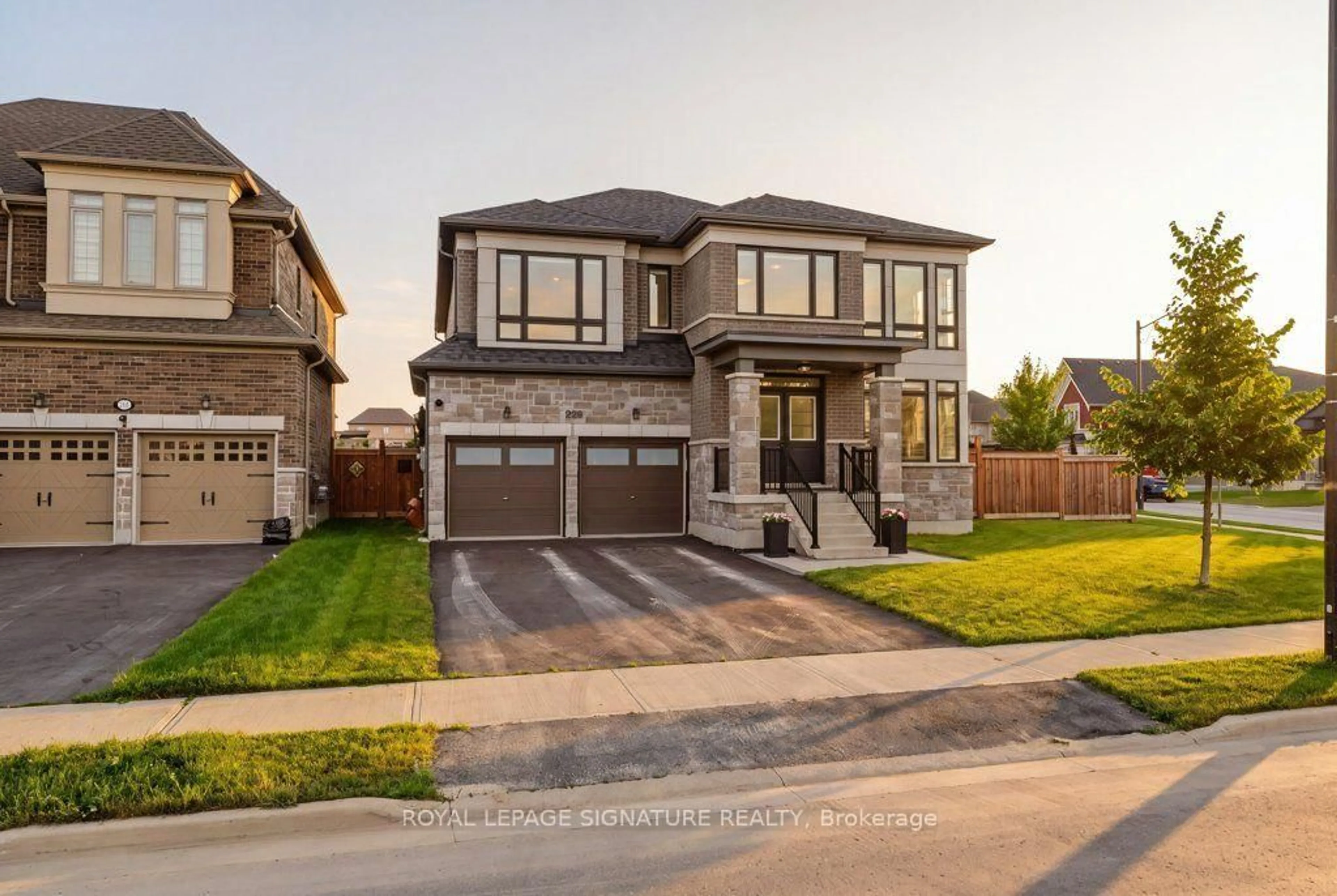 Home with brick exterior material, street for 228 Reg Harrison Tr, Newmarket Ontario L3X 0M4