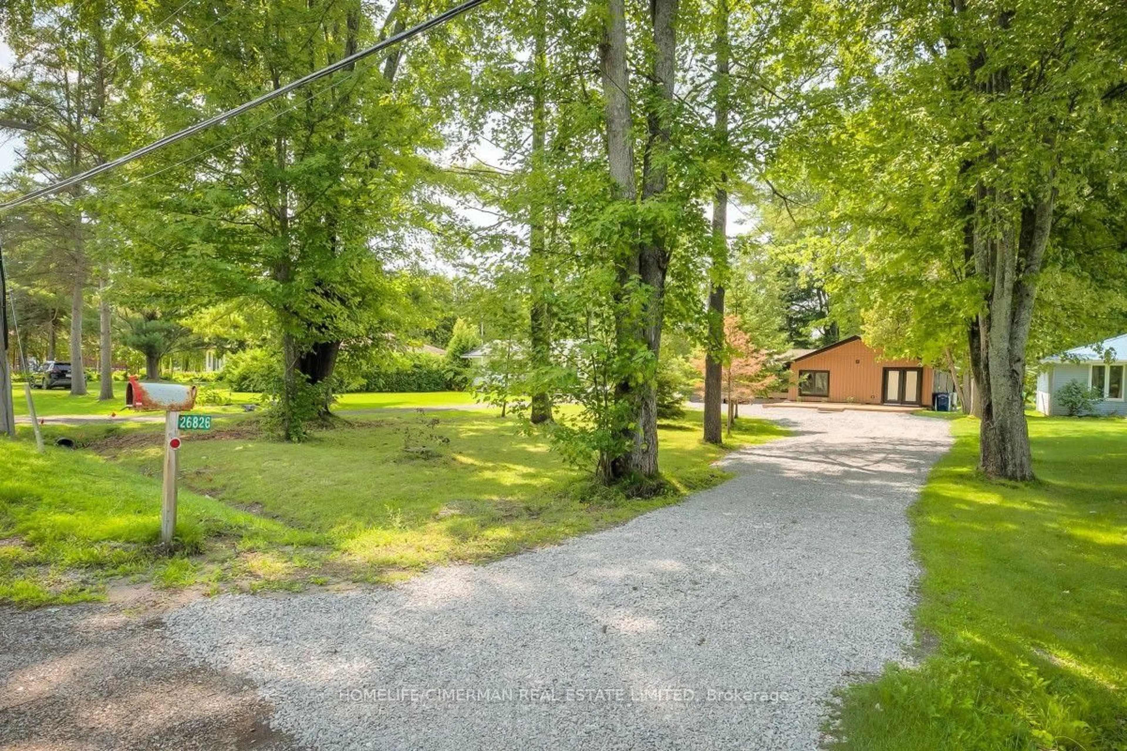 A pic from outside/outdoor area/front of a property/back of a property/a pic from drone, forest/trees view for 26826 Park Rd, Georgina Ontario L0E 1R0