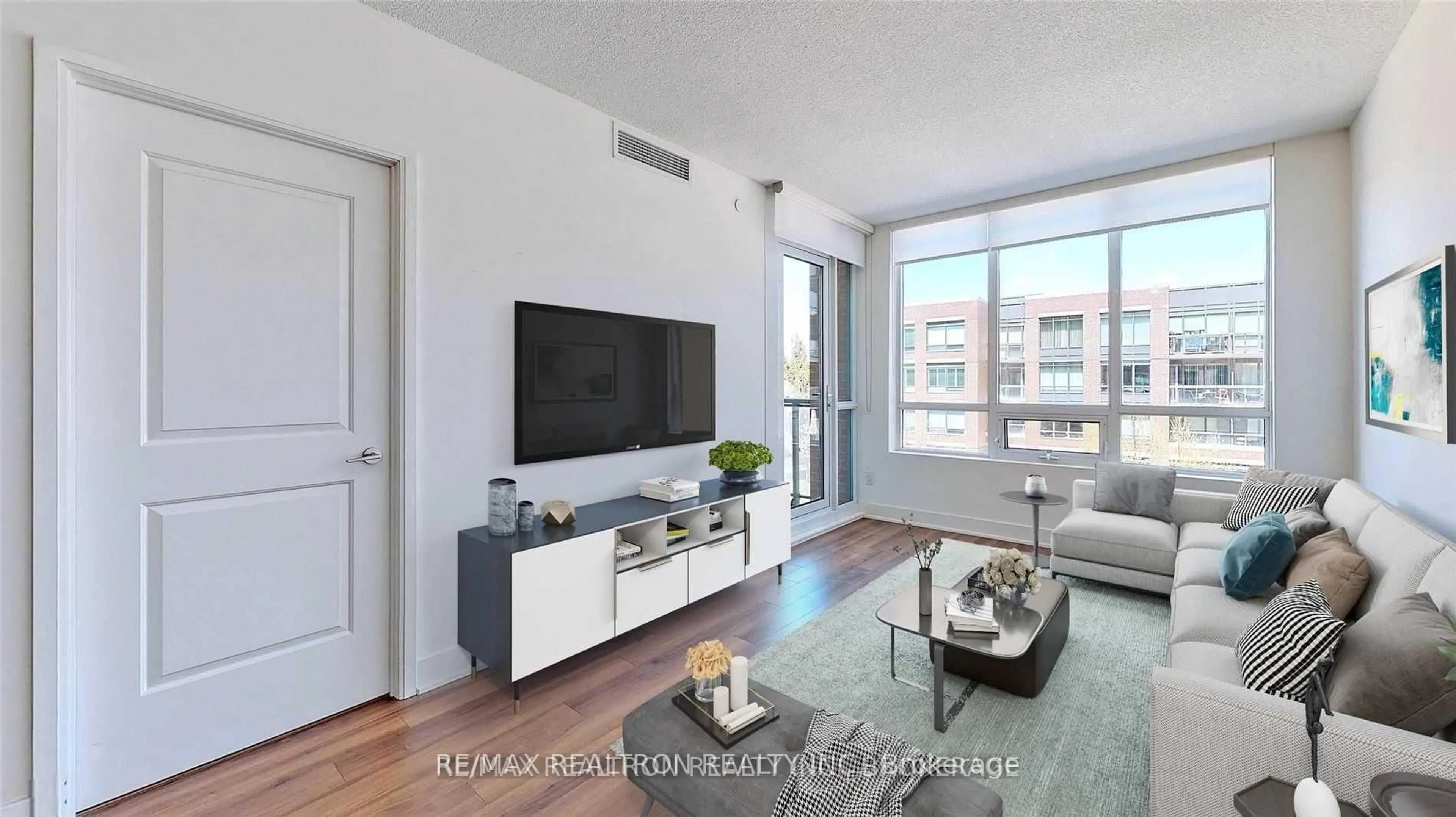 Living room with furniture, wood/laminate floor for 7608 Yonge St #403, Vaughan Ontario L4J 0J5