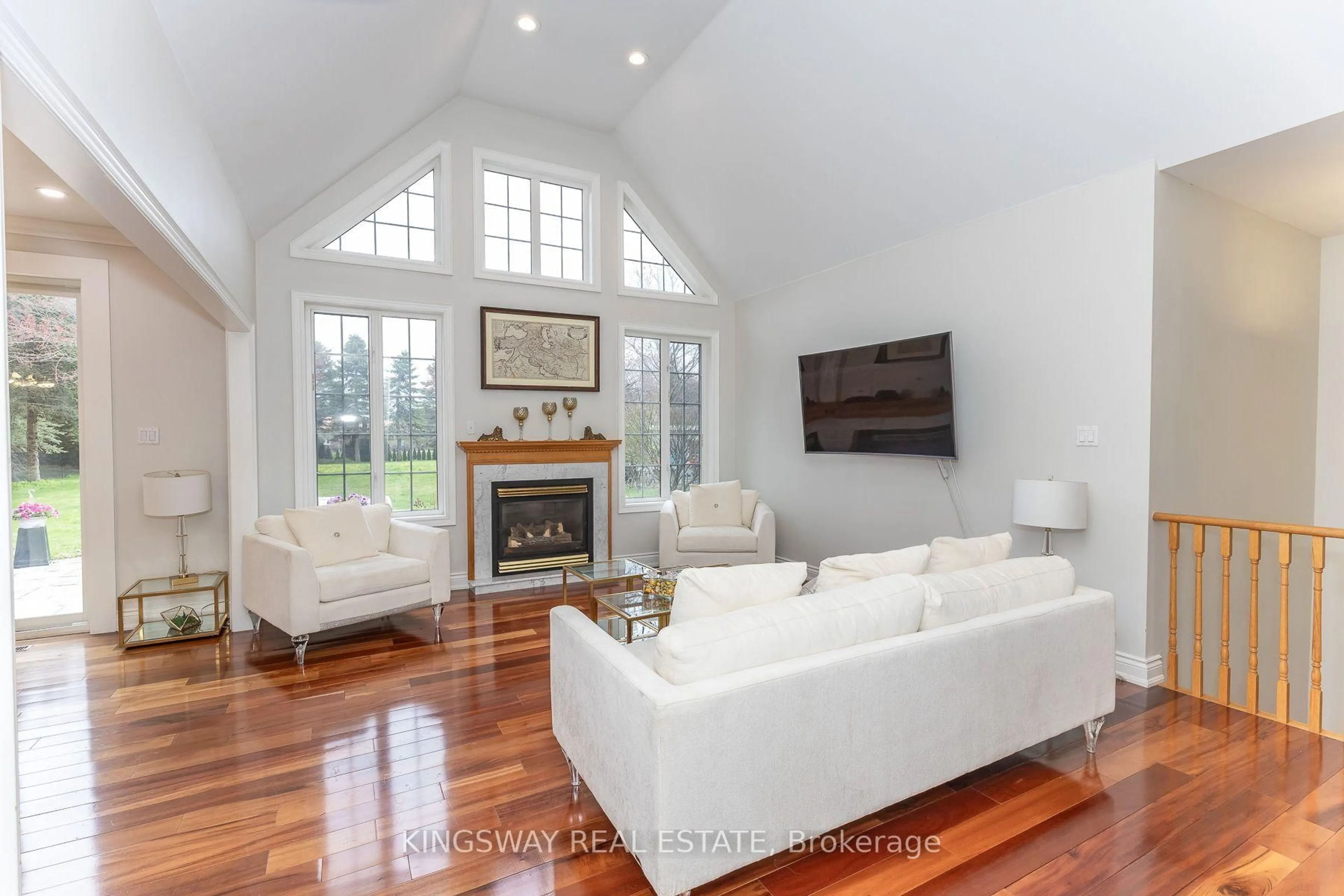 Living room with furniture, wood/laminate floor for 57 McMullen Dr, Whitchurch-Stouffville Ontario L4A 7X4