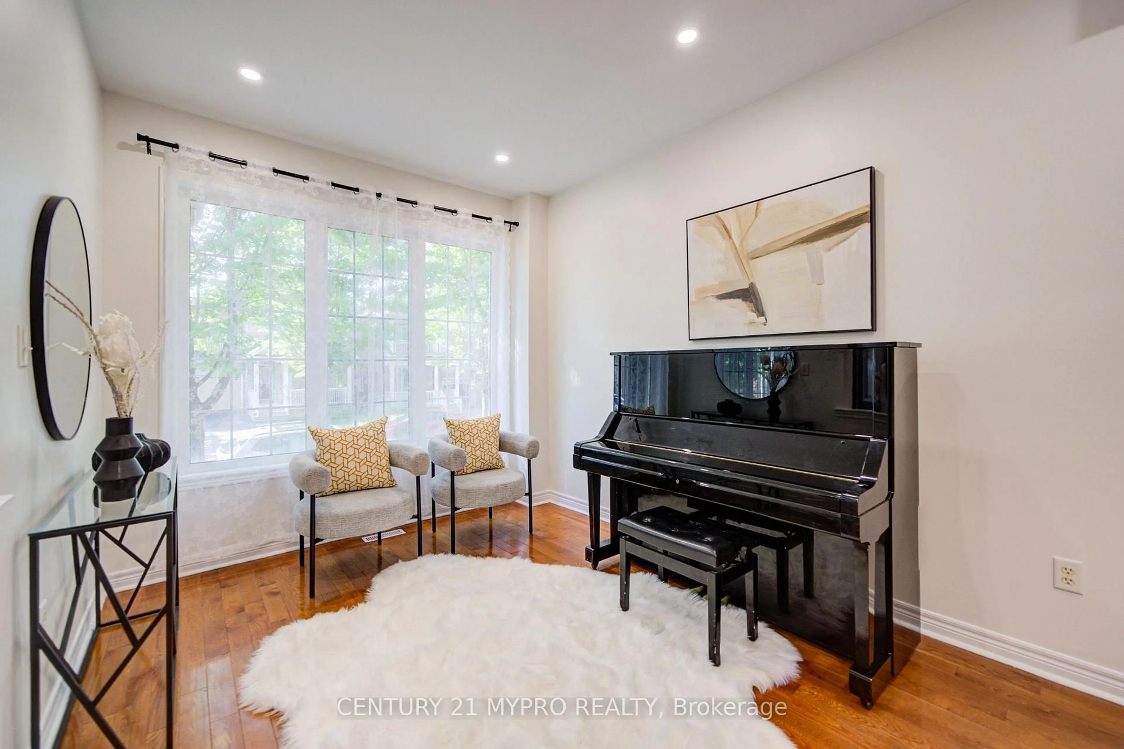 Living room with furniture, wood/laminate floor for 73 Pillar Rock Cres, Markham Ontario L6C 3H4