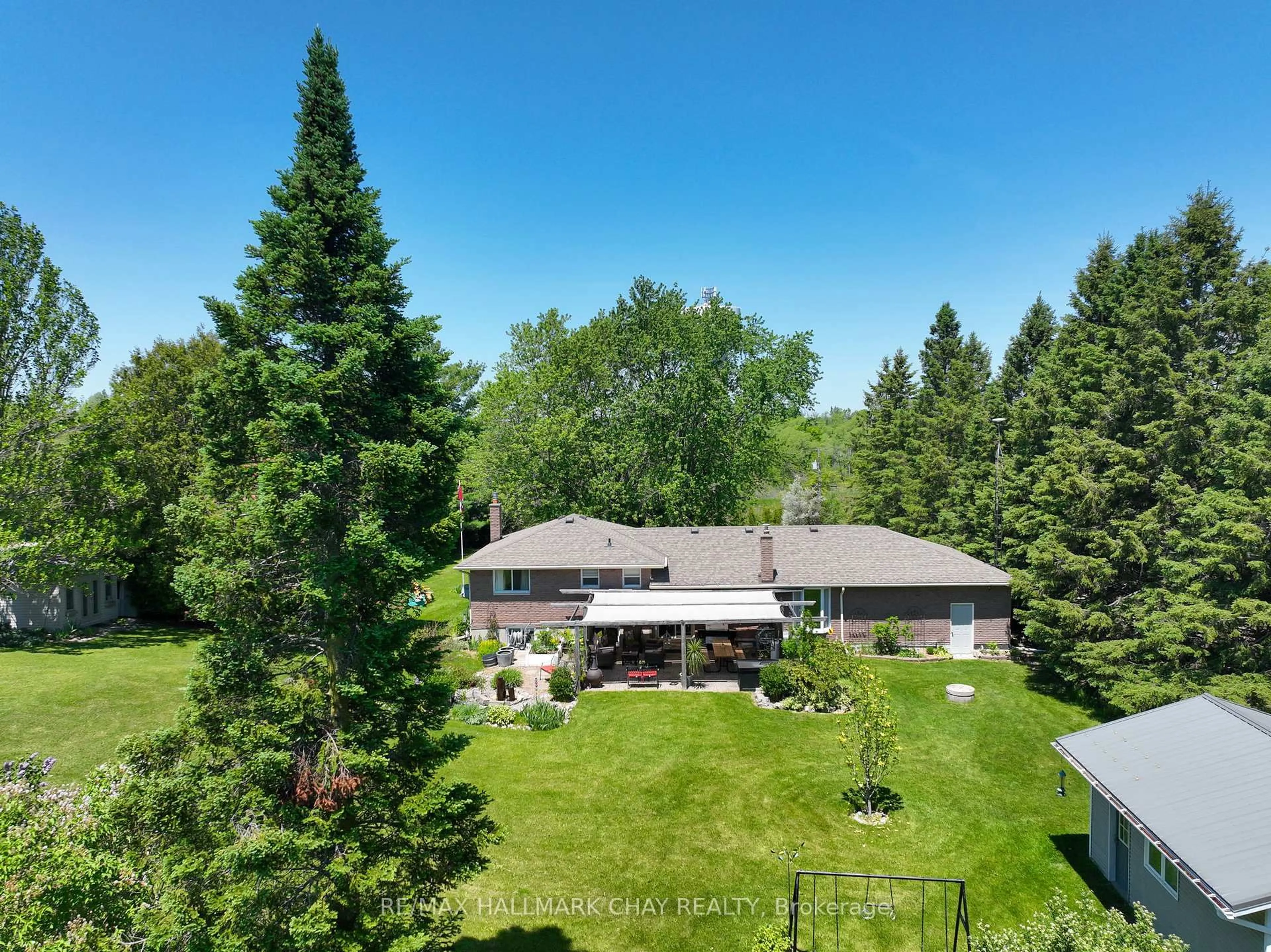 A pic from outside/outdoor area/front of a property/back of a property/a pic from drone, forest/trees view for 6815 4th Line, New Tecumseth Ontario L0G 1W0