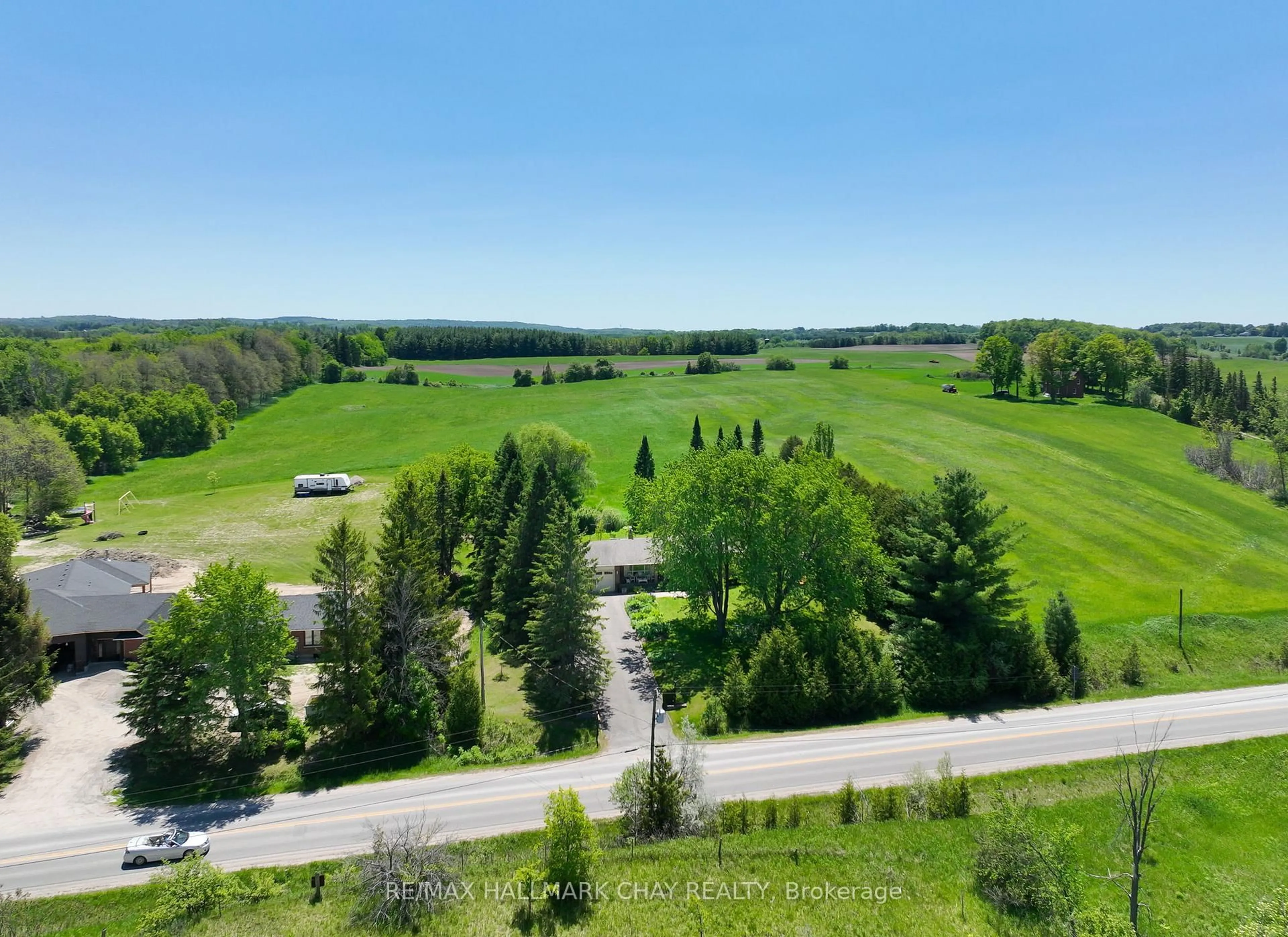 A pic from outside/outdoor area/front of a property/back of a property/a pic from drone, forest/trees view for 6815 4th Line, New Tecumseth Ontario L0G 1W0