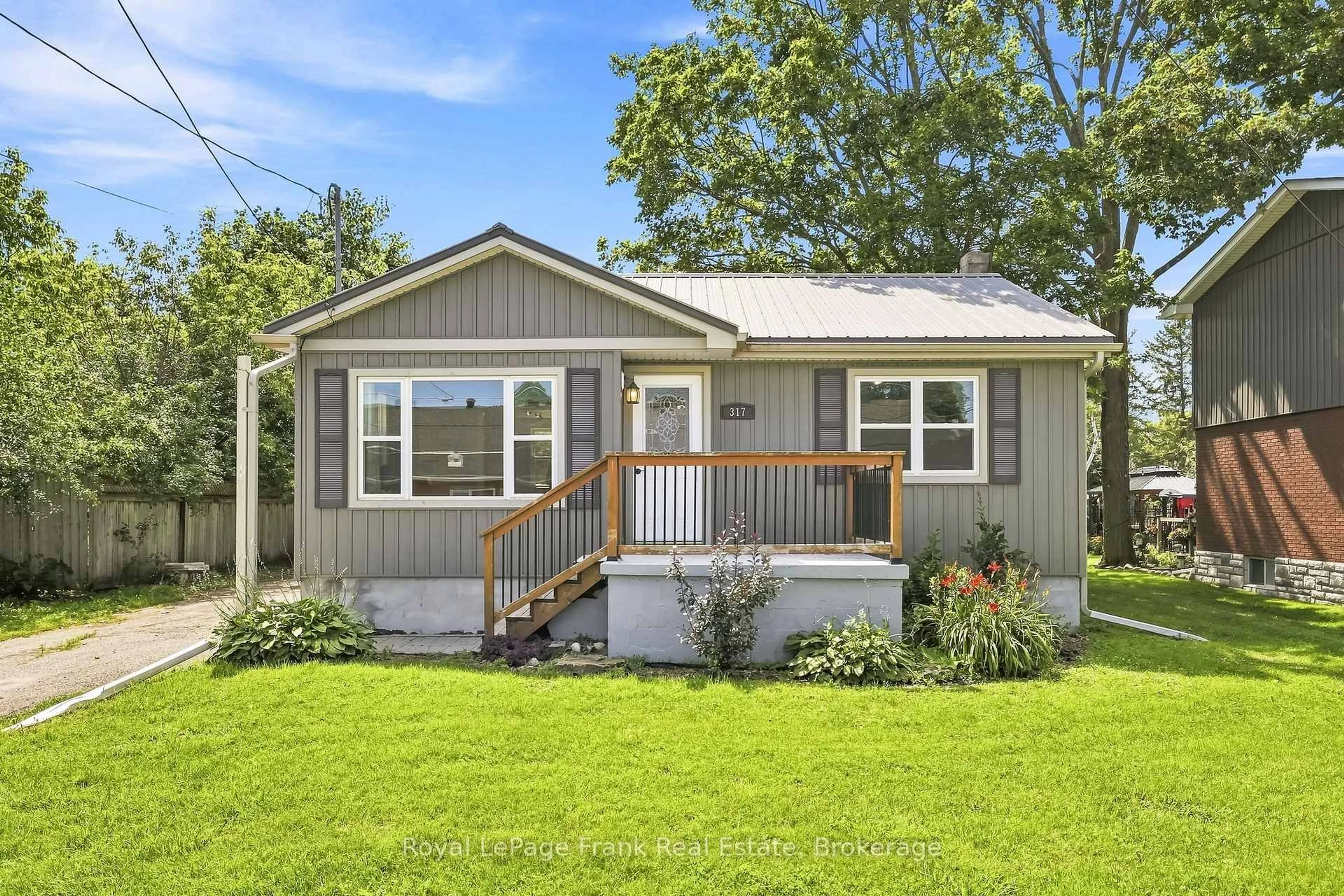 Home with vinyl exterior material, street for 317 Bay St, Brock Ontario L0K 1A0