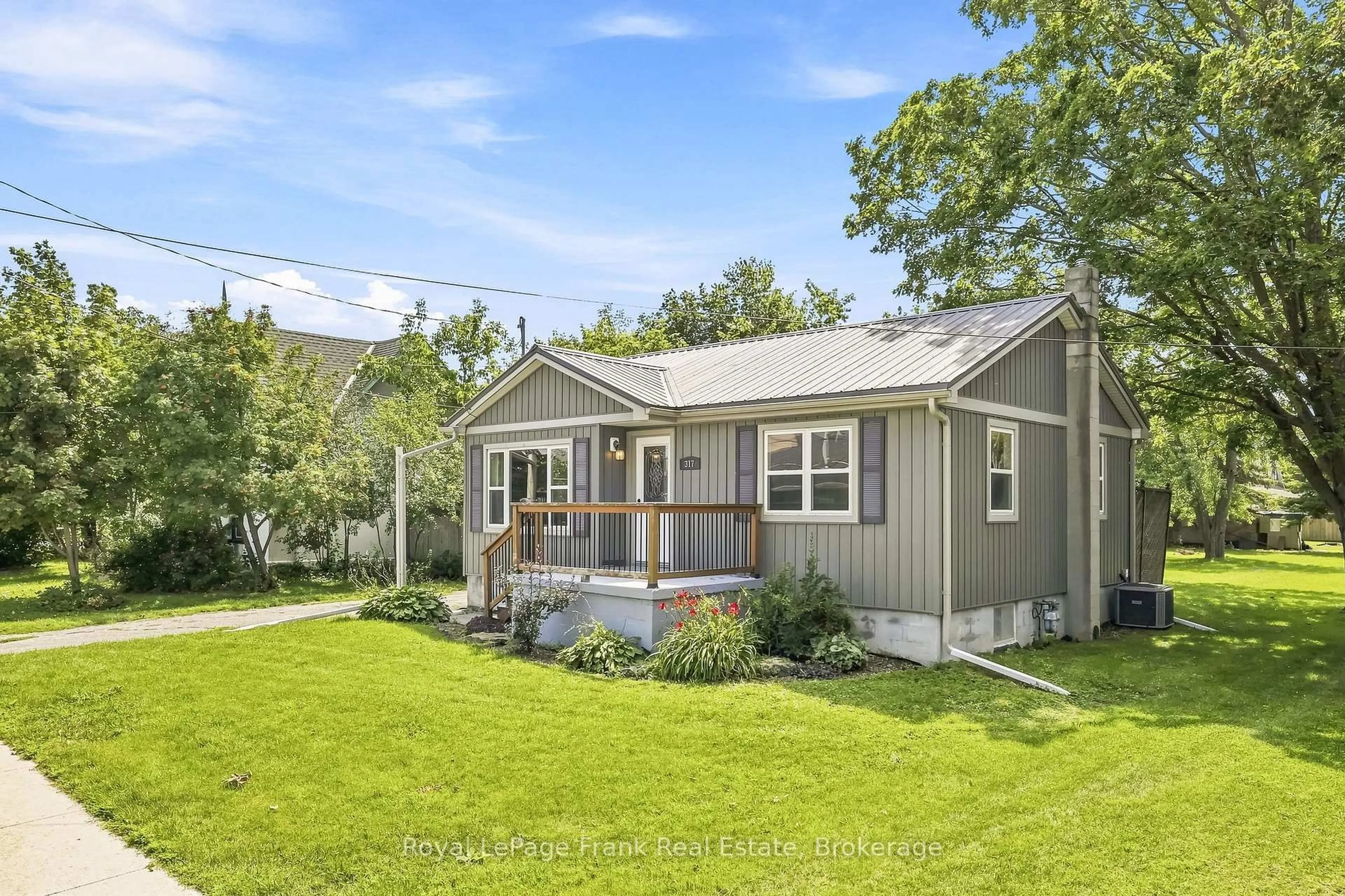 Home with vinyl exterior material, street for 317 Bay St, Brock Ontario L0K 1A0