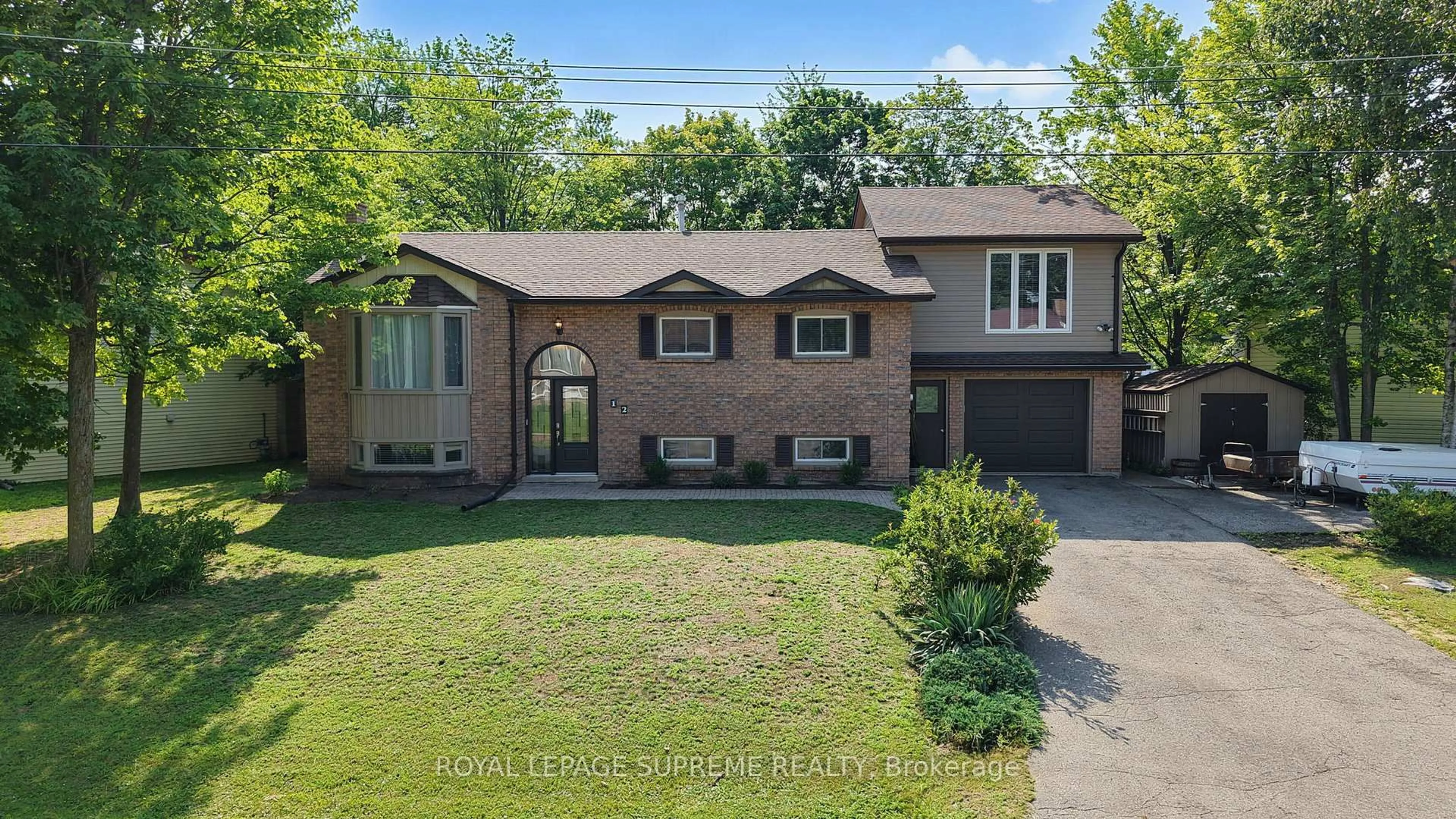 Home with brick exterior material, street for 12 Pridham Cres, Essa Ontario L3W 0G5