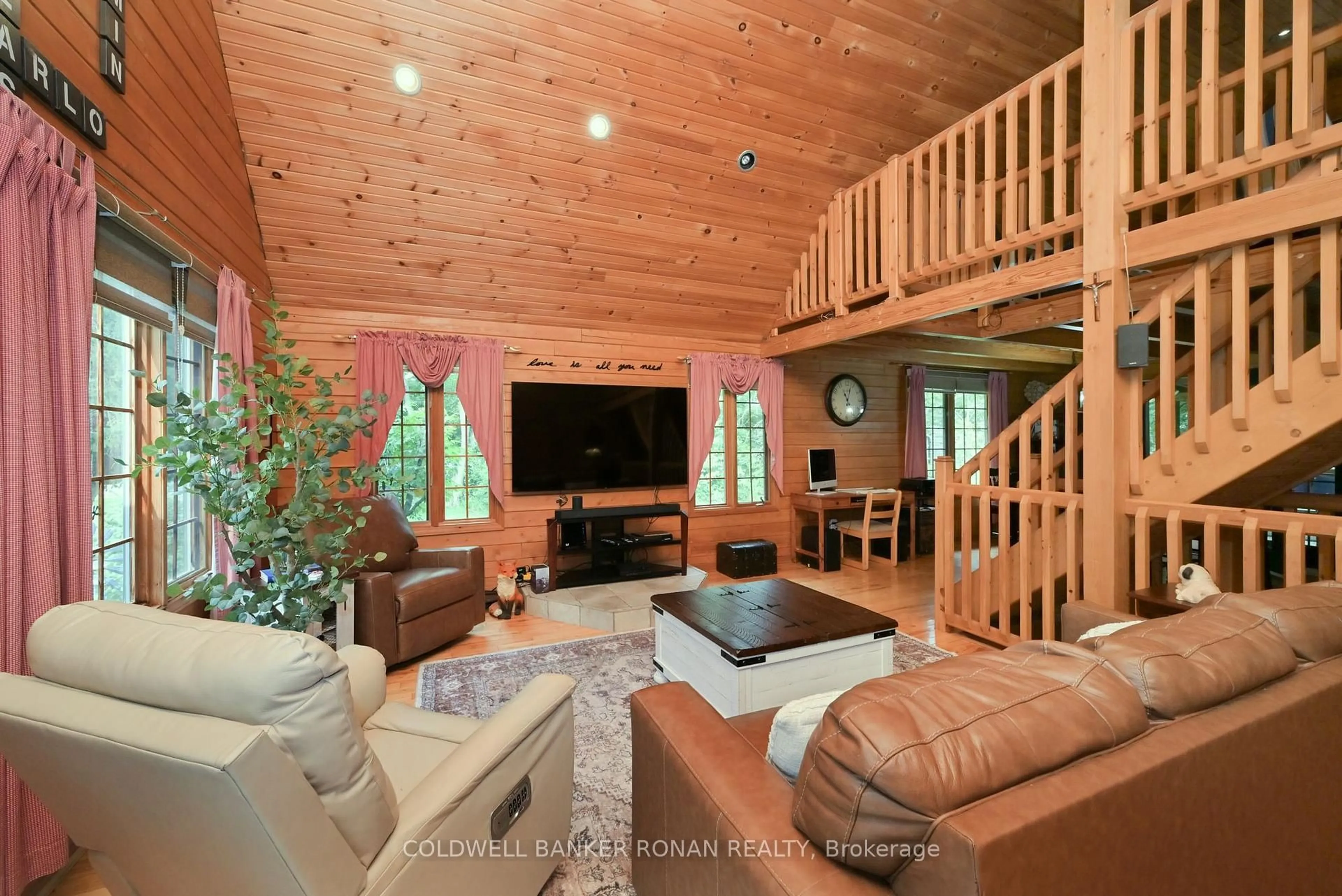 Living room with furniture, wood/laminate floor for 7975 County Road 13, Adjala-Tosorontio Ontario L0M 1M0
